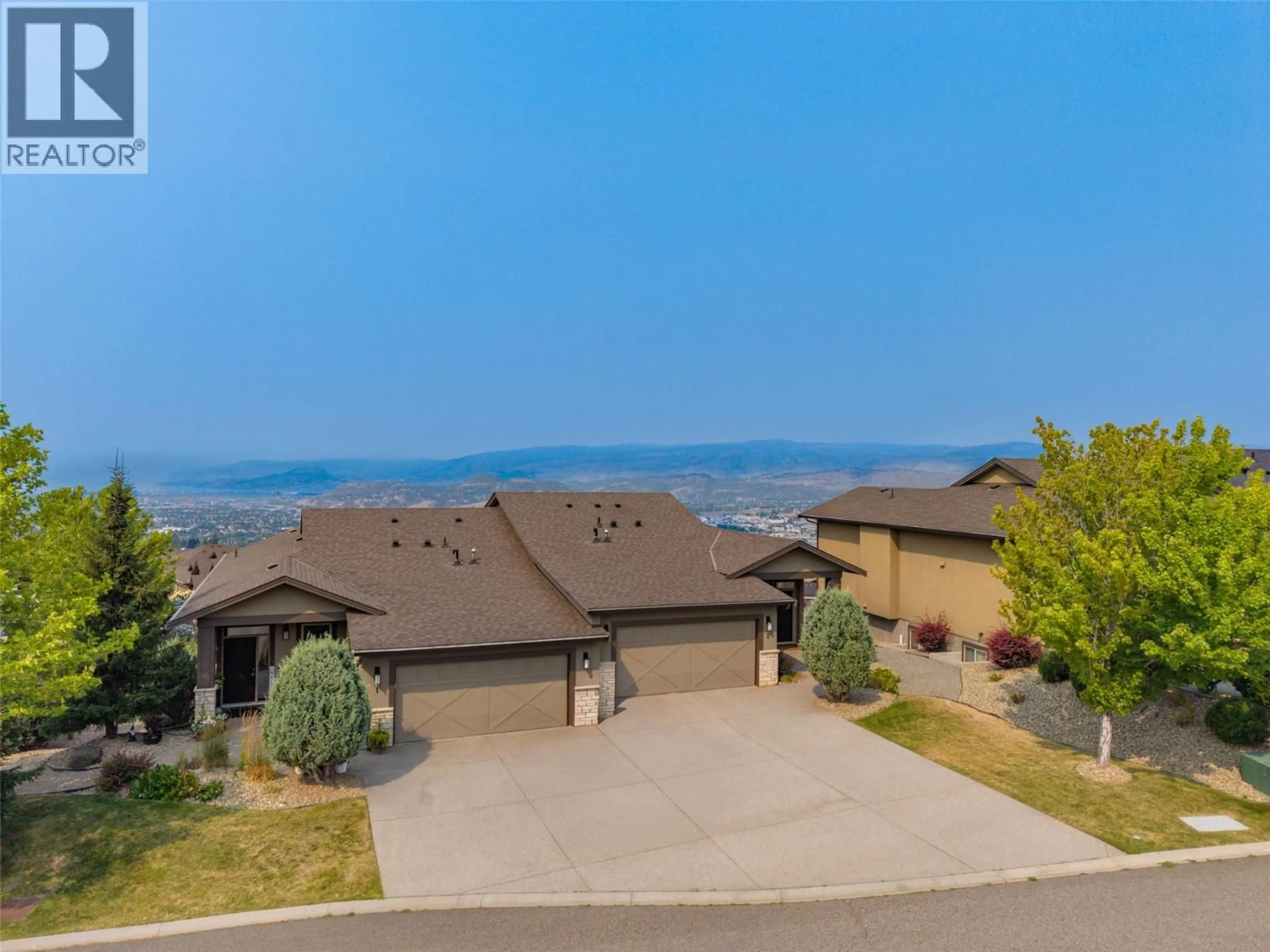 A pic from outside/outdoor area/front of a property/back of a property/a pic from drone, mountain view for 2 - 1836 TOWER RANCH BOULEVARD, Kelowna British Columbia V1P1S8