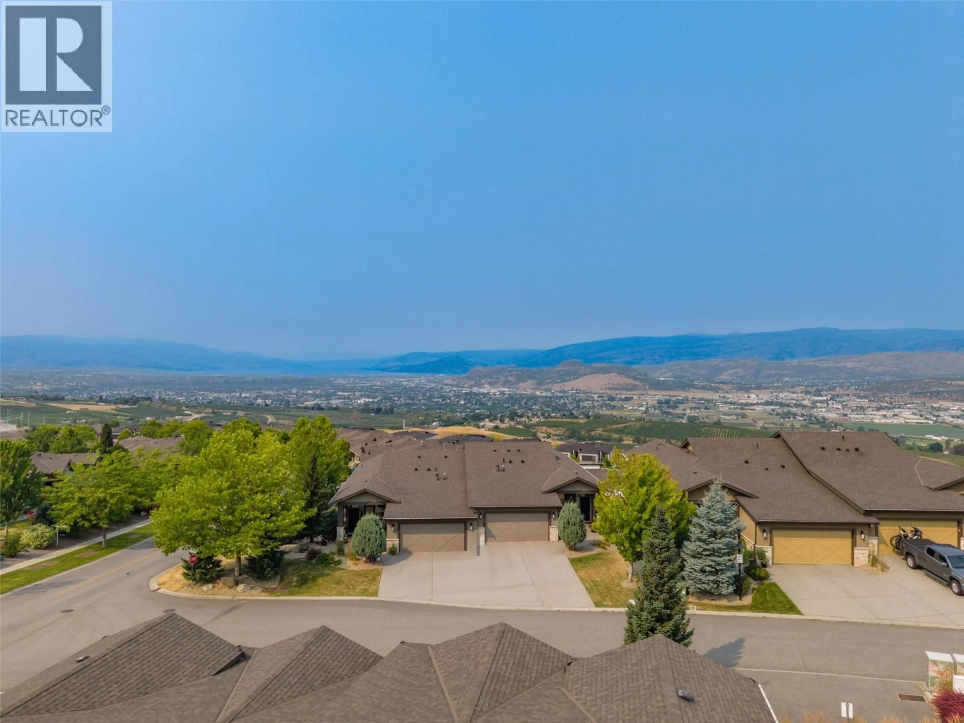 A pic from outside/outdoor area/front of a property/back of a property/a pic from drone, mountain view for 2 - 1836 TOWER RANCH BOULEVARD, Kelowna British Columbia V1P1S8