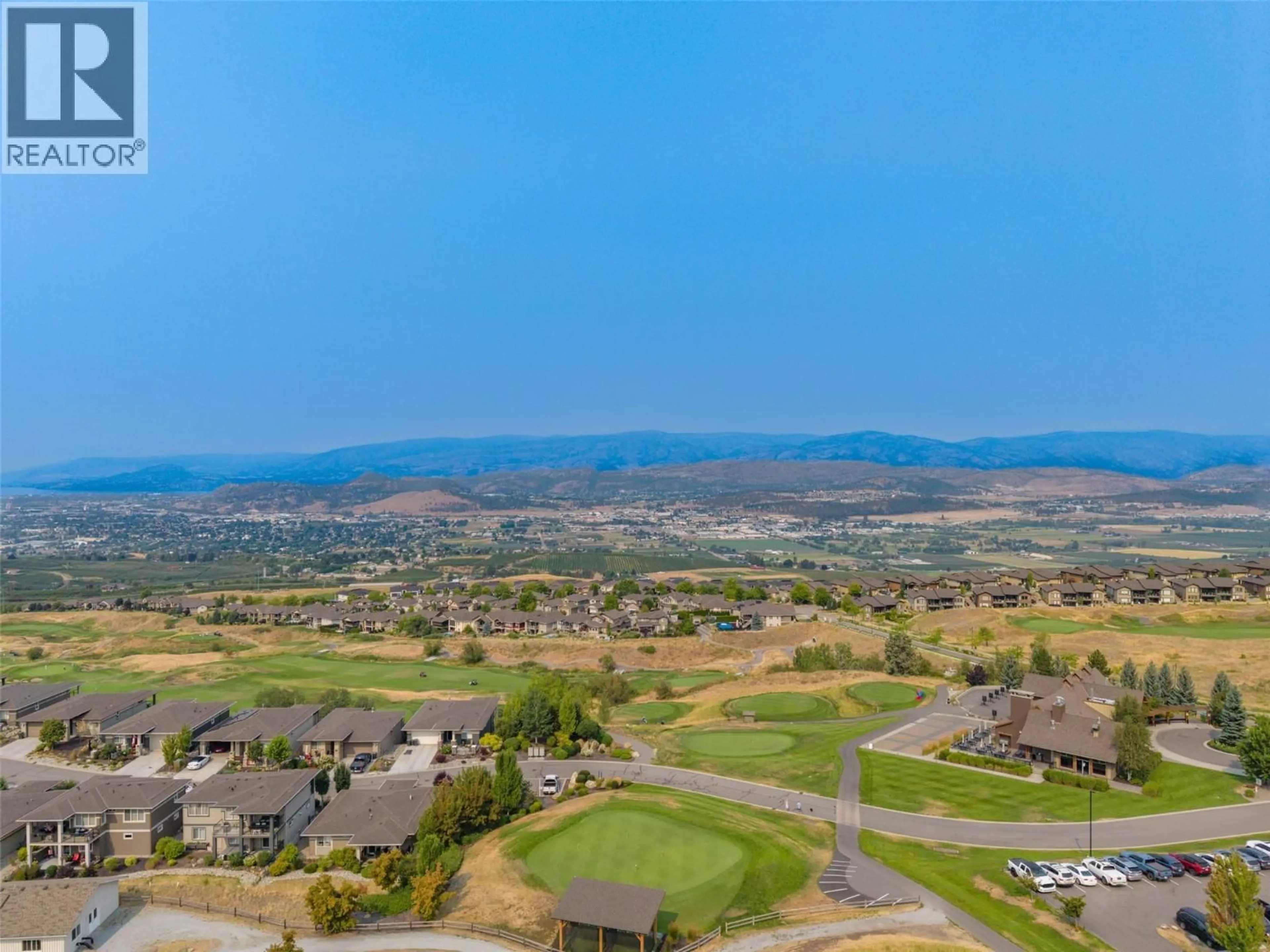A pic from outside/outdoor area/front of a property/back of a property/a pic from drone, mountain view for 2 - 1836 TOWER RANCH BOULEVARD, Kelowna British Columbia V1P1S8