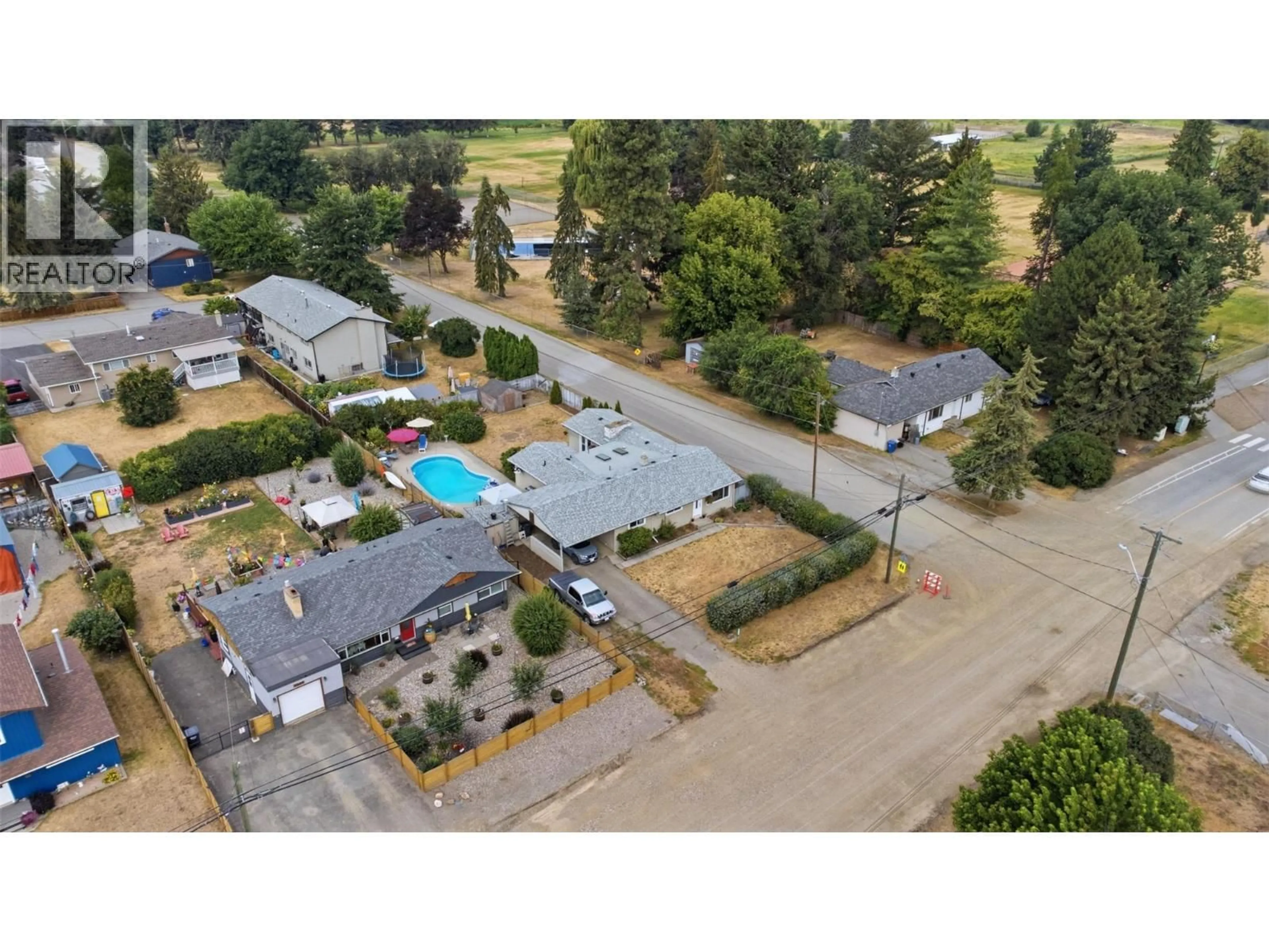 A pic from outside/outdoor area/front of a property/back of a property/a pic from drone, street for 9694 SCHOOL ROAD, Coldstream British Columbia V1B3G4