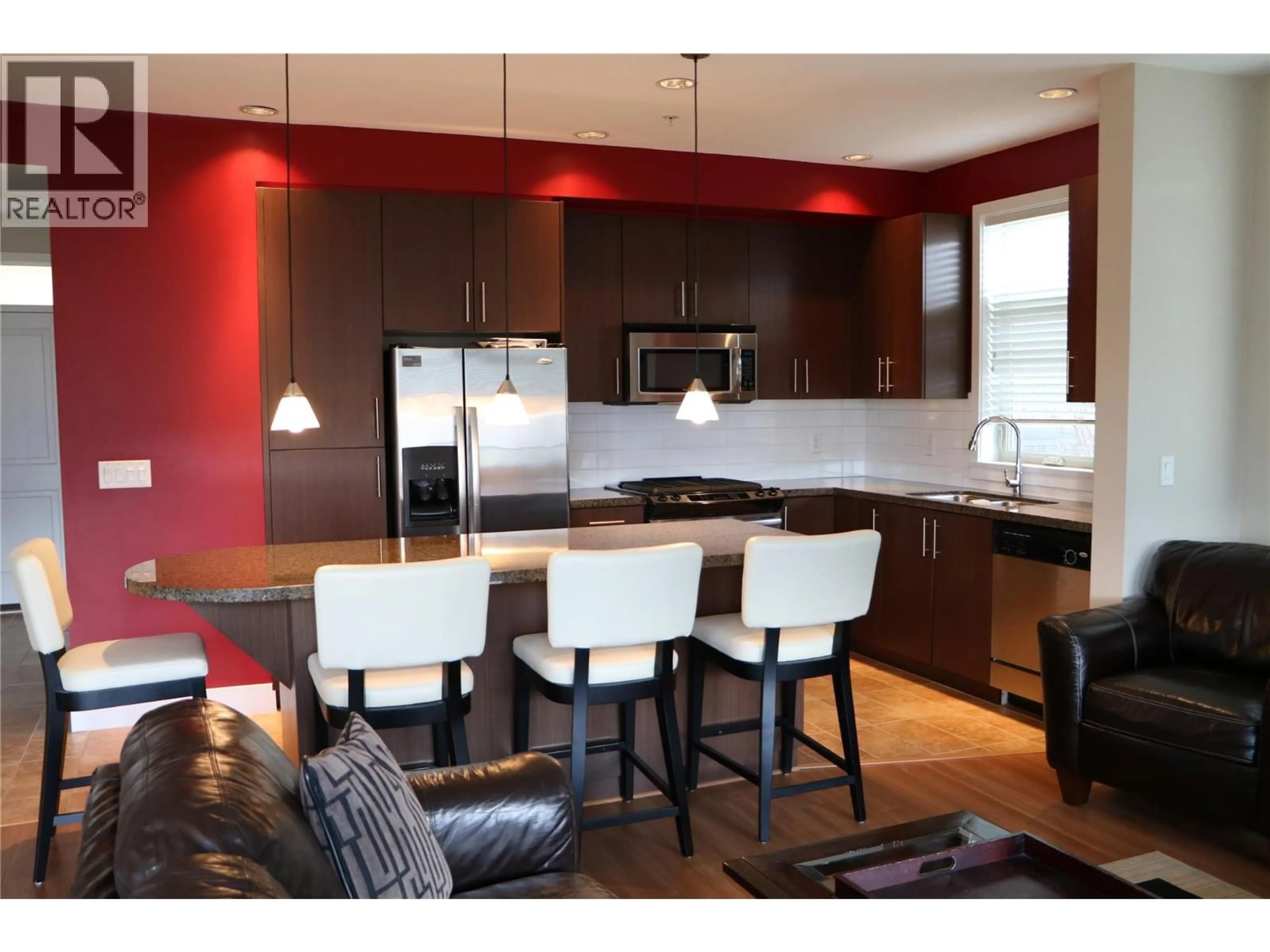 Open concept kitchen, wood/laminate floor for 61 - 130 COLEBROOK ROAD, Kamloops British Columbia V1S0B4