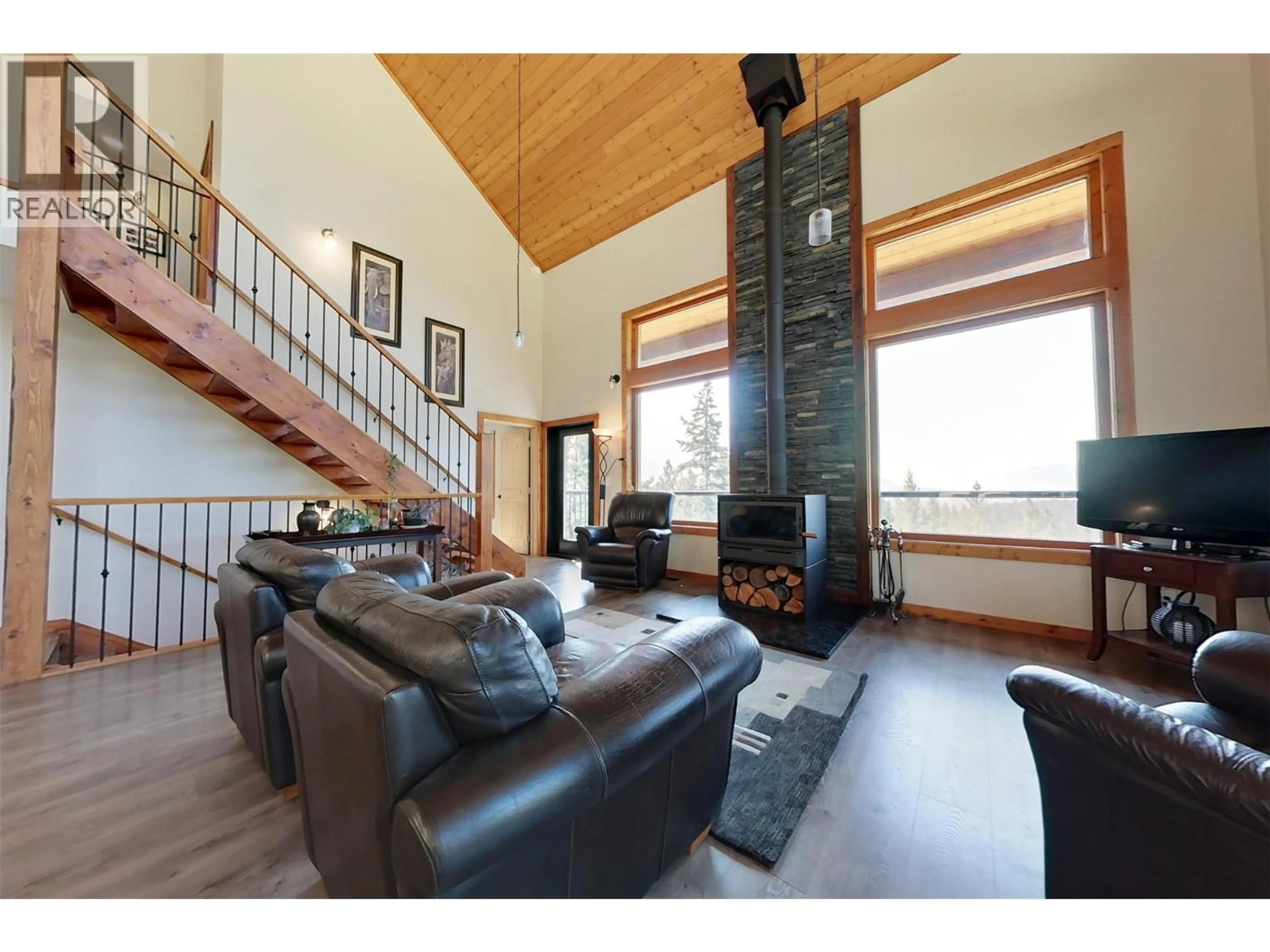 Living room with furniture, wood/laminate floor for 3820 SUN RIDGE ROAD, Erickson British Columbia V0B1G1