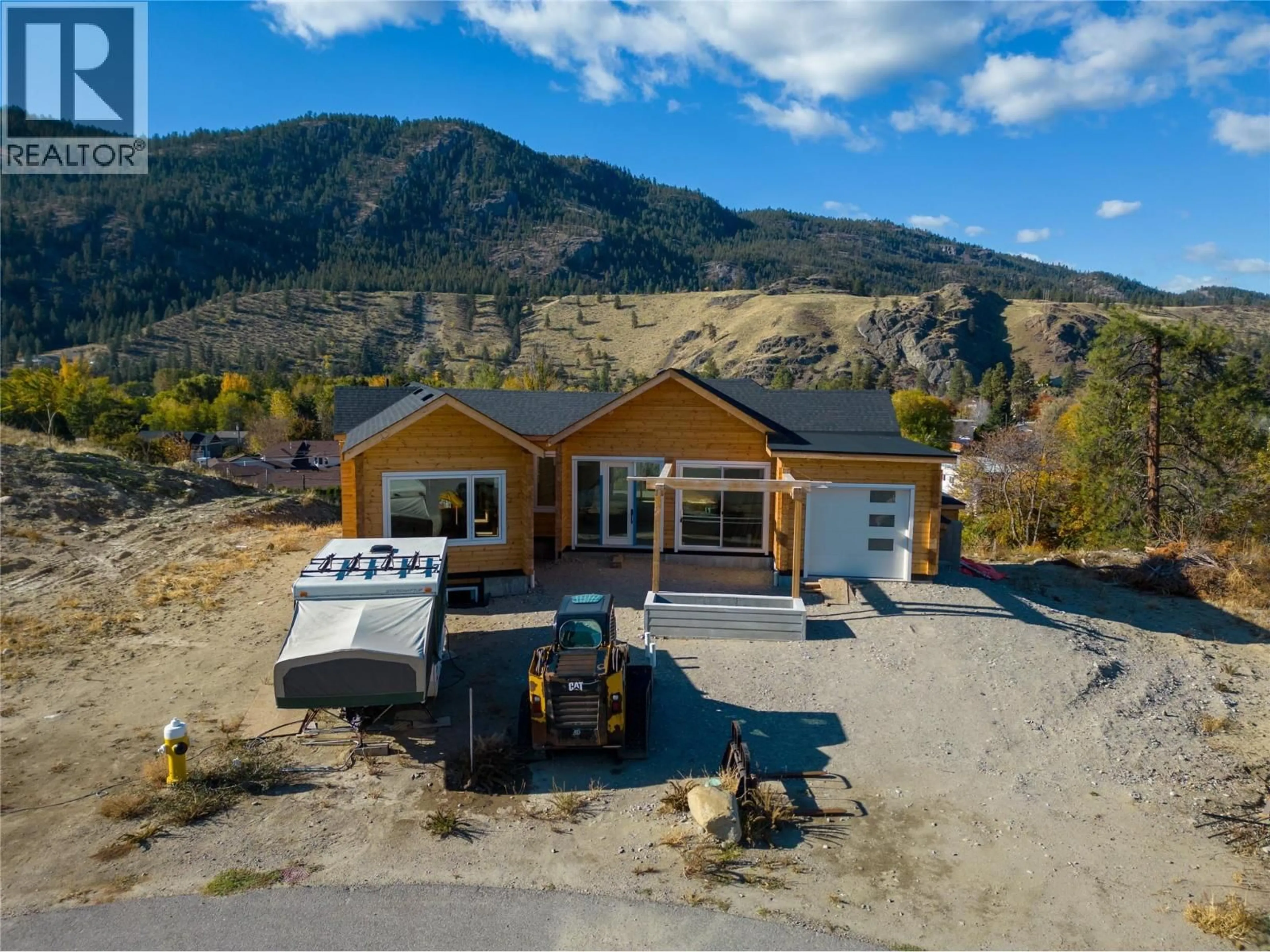 A pic from outside/outdoor area/front of a property/back of a property/a pic from drone, mountain view for 4850 BASSETT AVENUE, Okanagan Falls British Columbia V0H1R2