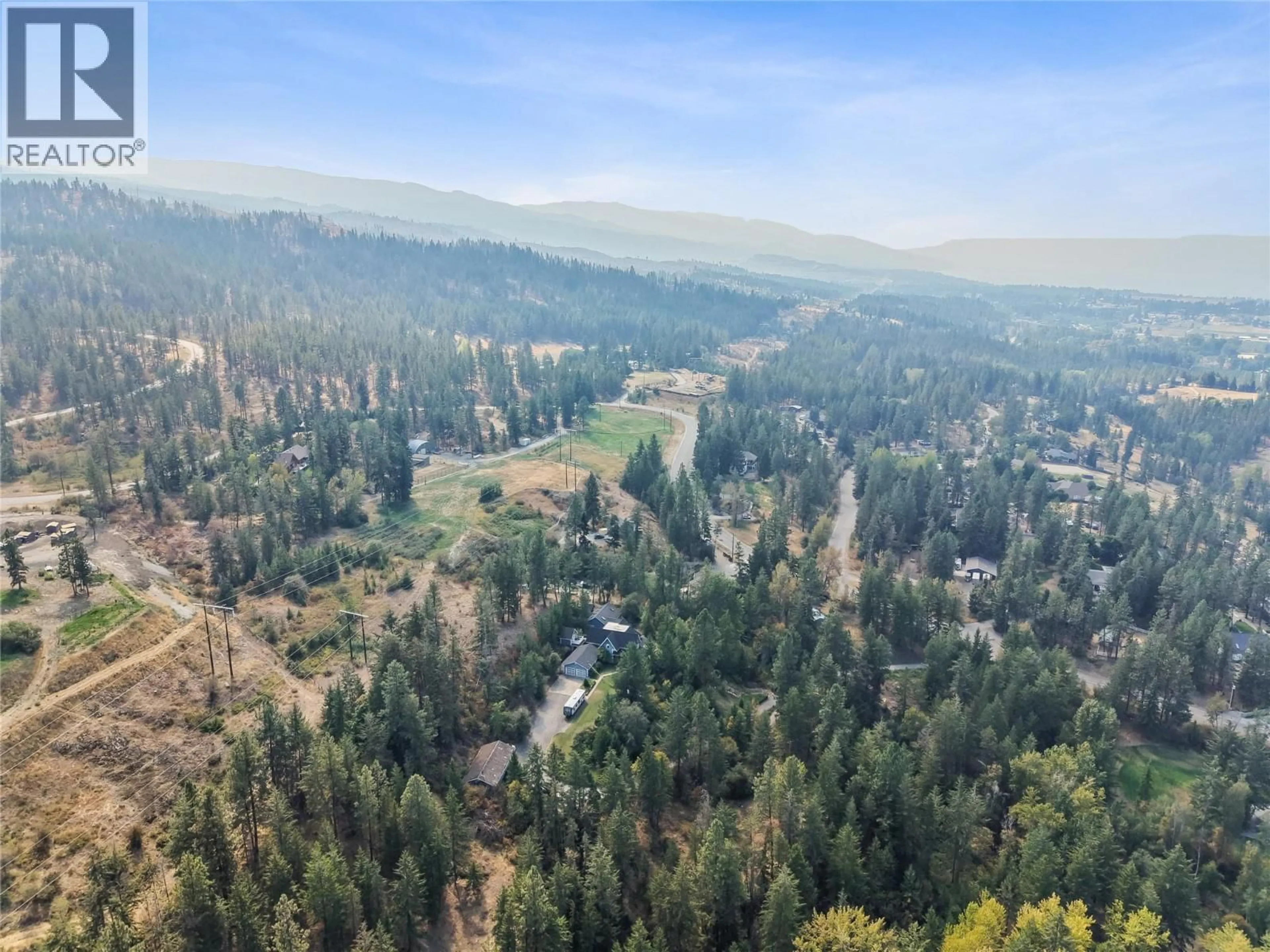 A pic from outside/outdoor area/front of a property/back of a property/a pic from drone, forest/trees view for 4345 JUNE SPRINGS ROAD, Kelowna British Columbia V1W4C8