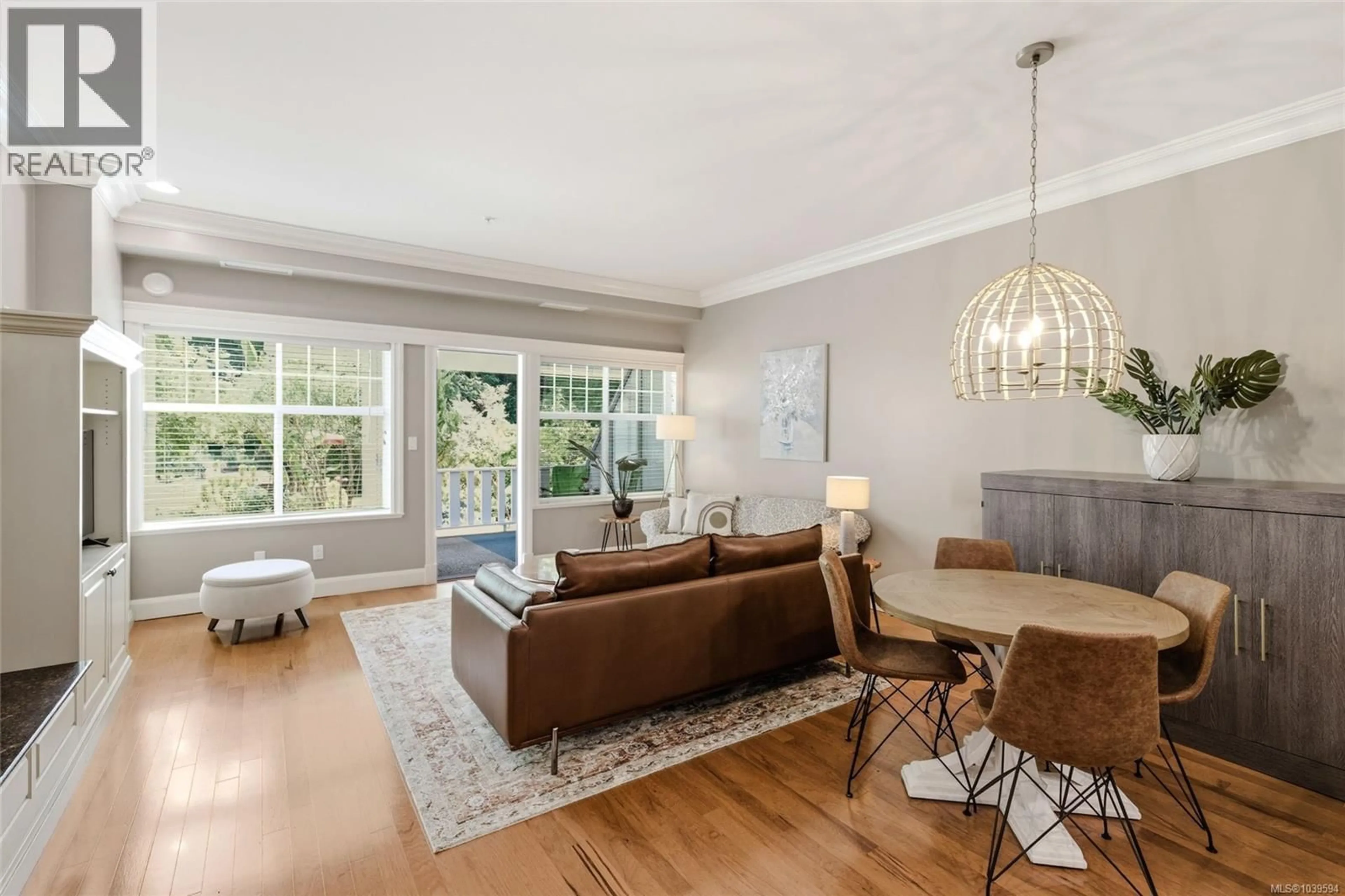 Living room with furniture, wood/laminate floor for 105 - 292 CRESCENT ROAD EAST, Qualicum Beach British Columbia V9K0A5