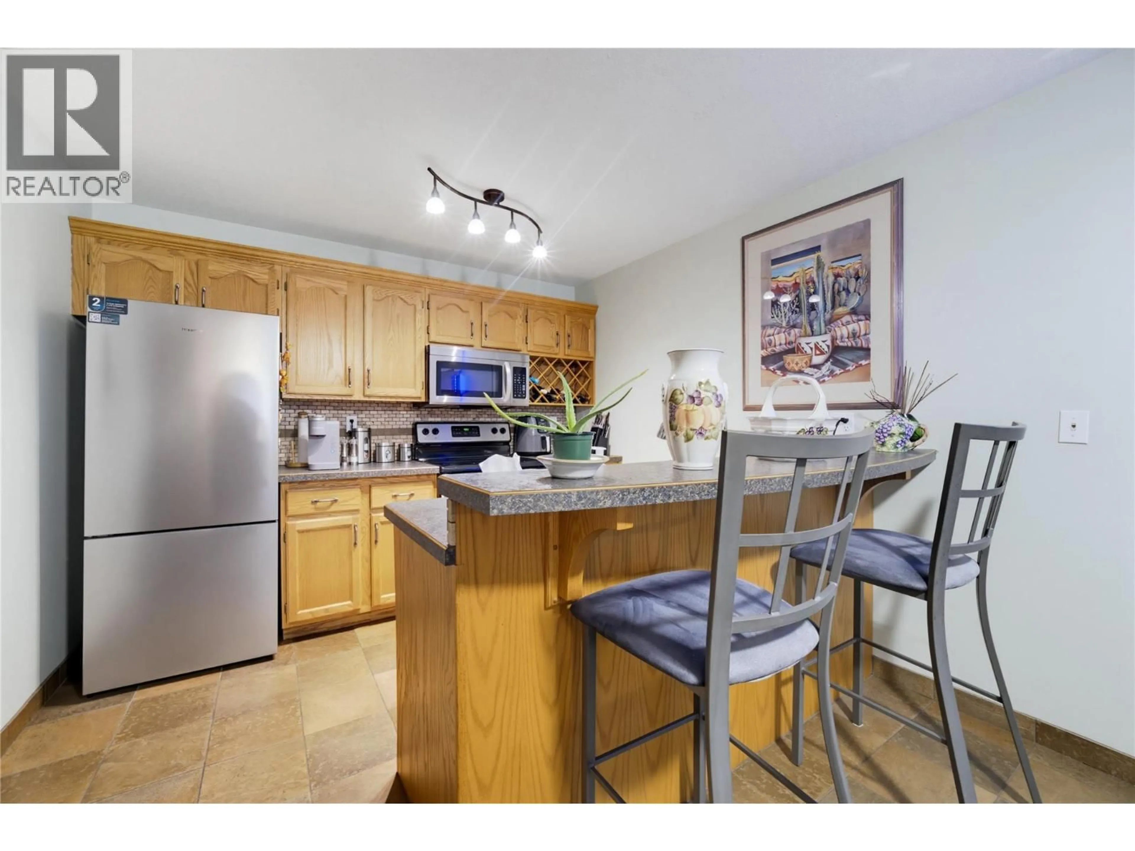 Standard kitchen, wood/laminate floor for 208 - 250 5TH STREET SOUTHEAST, Salmon Arm British Columbia V1E1J8