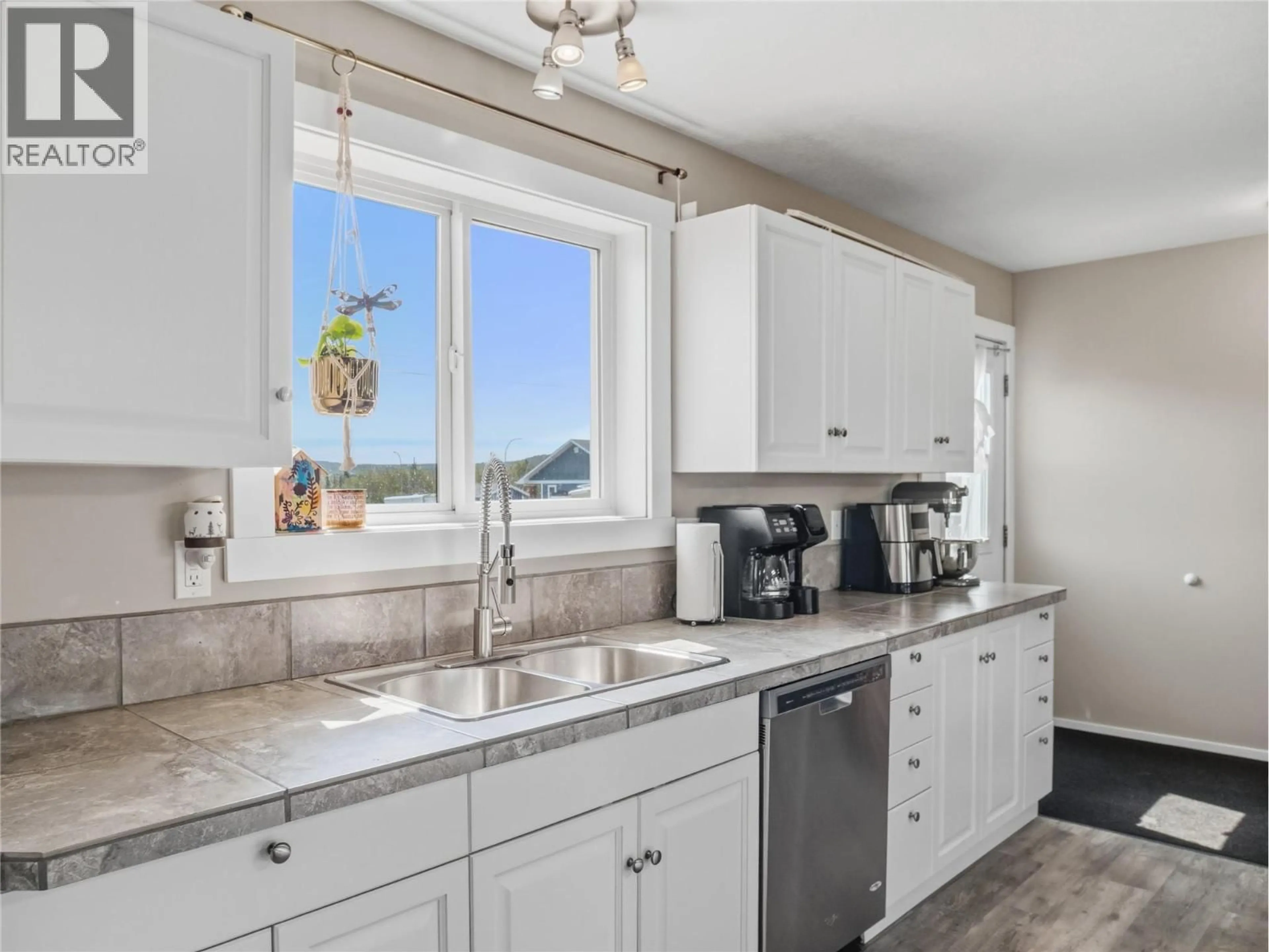 Open concept kitchen, ceramic/tile floor for 4609 RAILWAY AVENUE, Pouce Coupe British Columbia V0C2C0