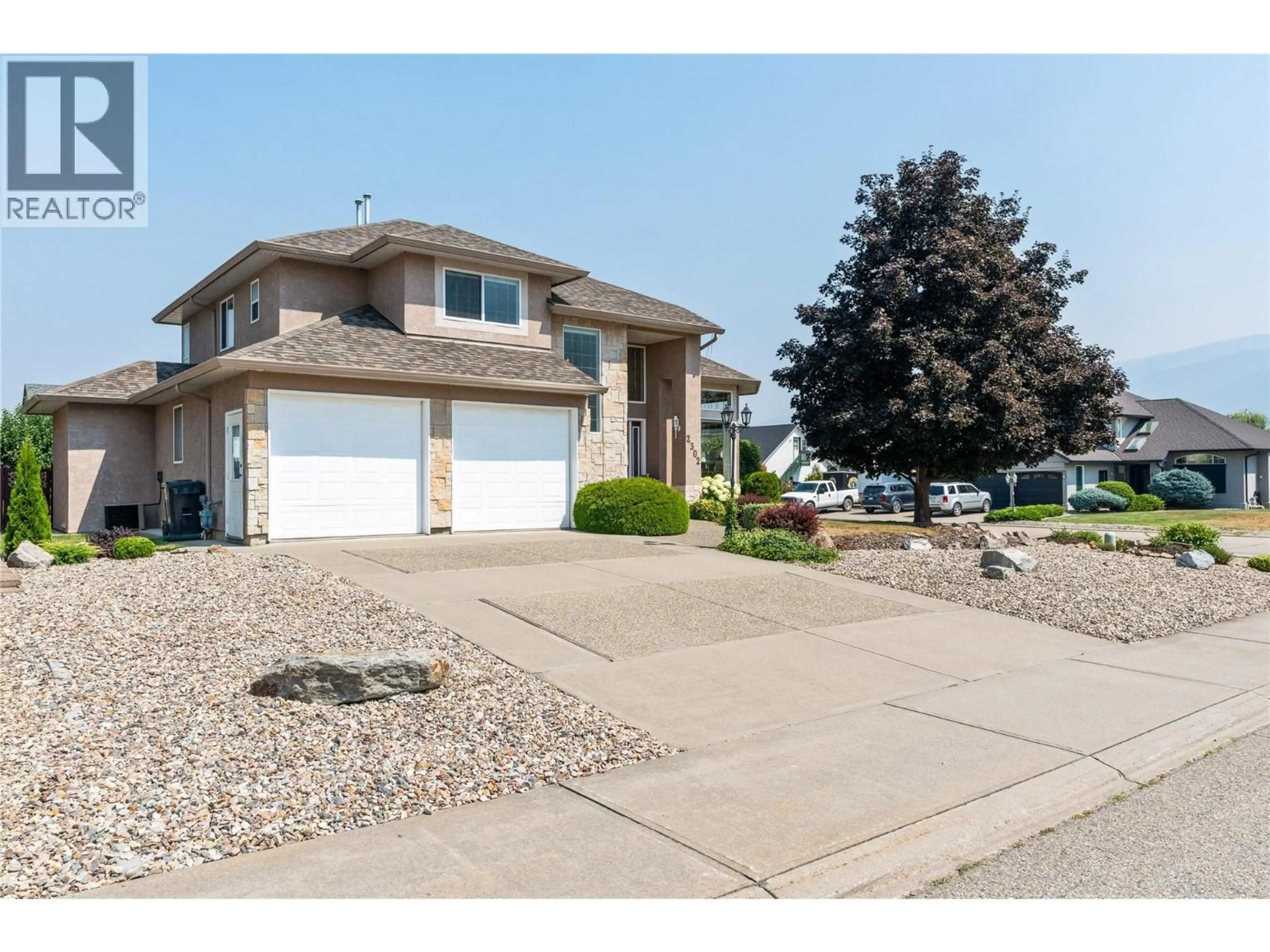 Home with vinyl exterior material, street for 2302 MAUNDRELL AVENUE, Armstrong British Columbia V4Y0C2