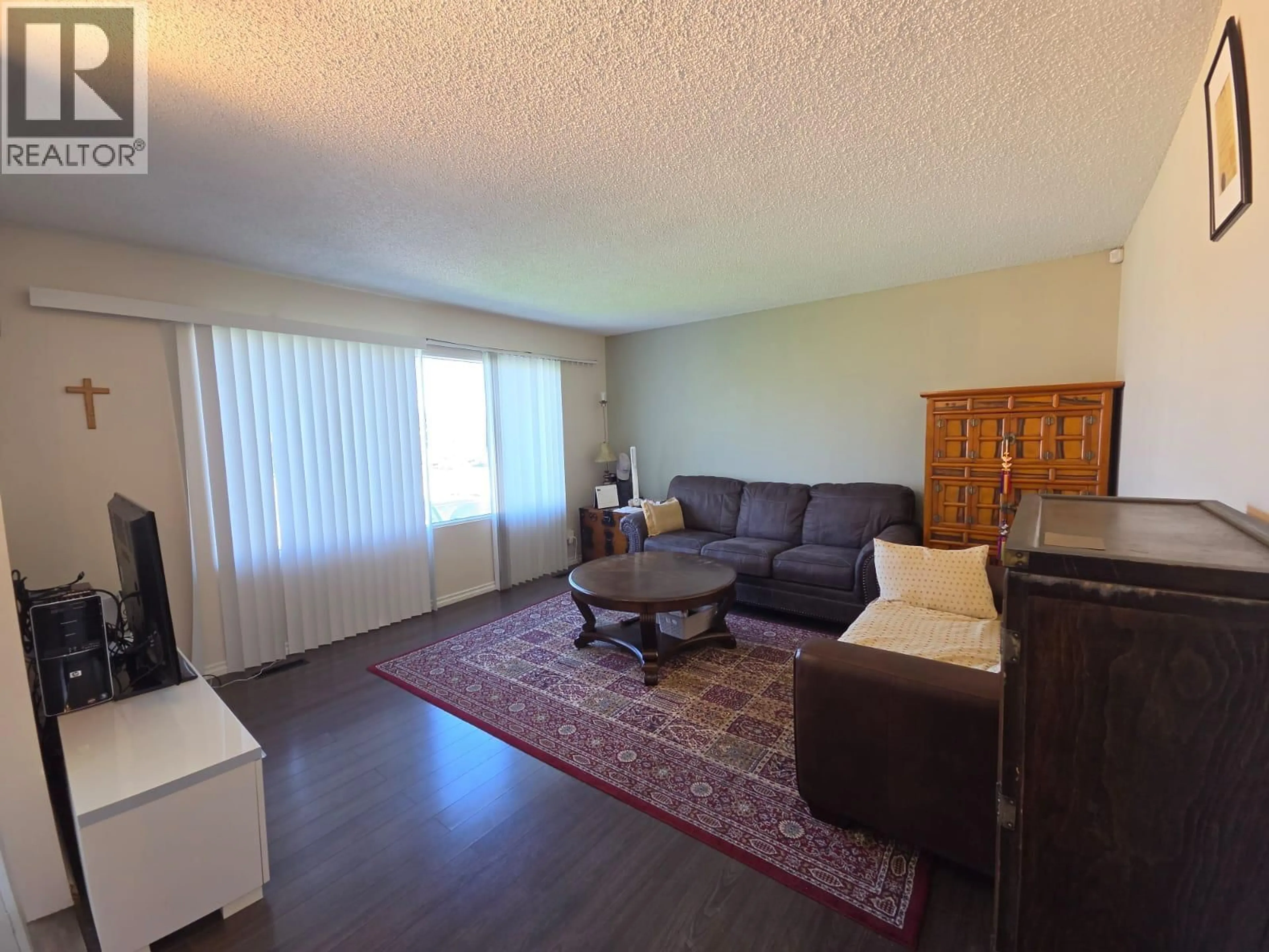 Living room with furniture, wood/laminate floor for 1817 ASPEN DRIVE, Dawson Creek British Columbia V1G2S5