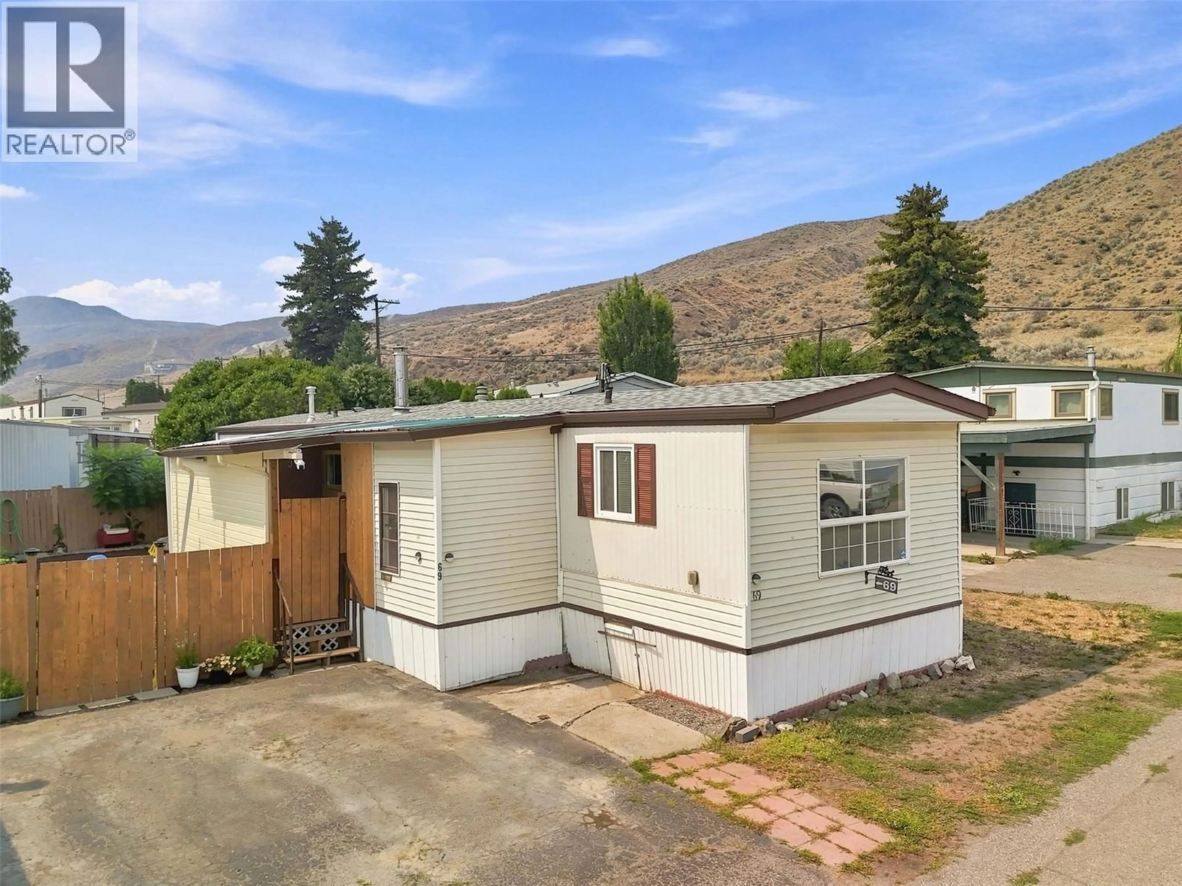 A pic from outside/outdoor area/front of a property/back of a property/a pic from drone, mountain view for 69 - 1655 ORD ROAD, Kamloops British Columbia V2B7V6
