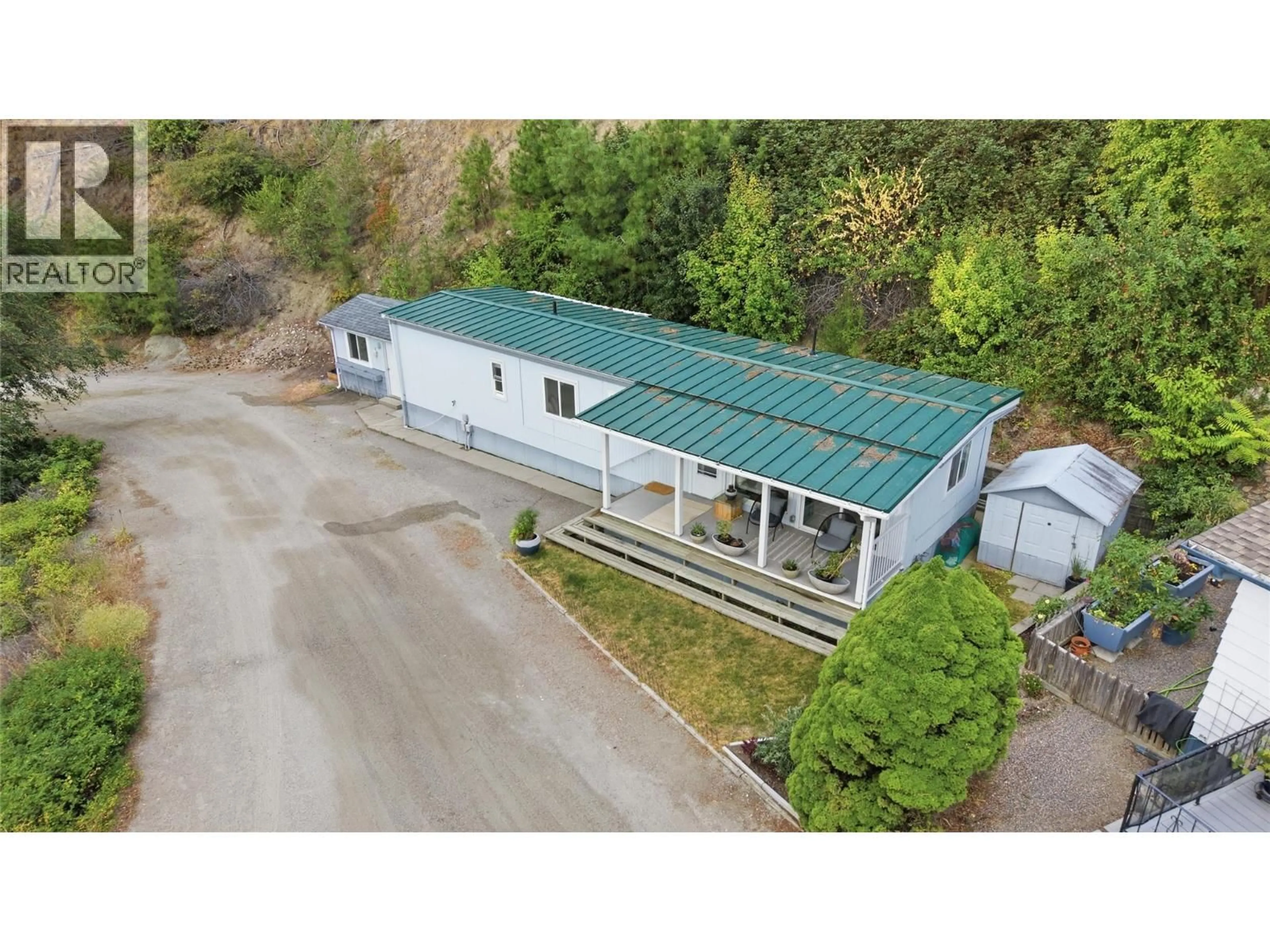 A pic from outside/outdoor area/front of a property/back of a property/a pic from drone, building for 32 - 6711 HIGHWAY 97 OTHER SOUTH, Peachland British Columbia V0H1X9