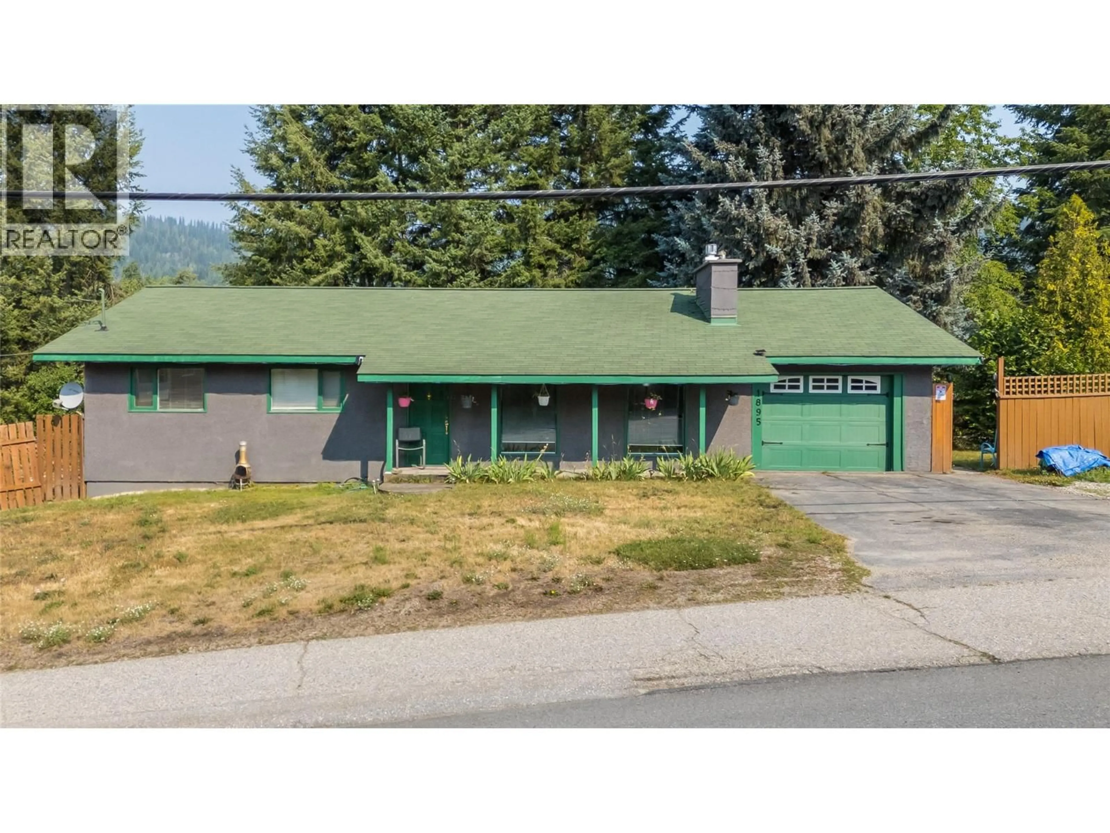 Home with vinyl exterior material, street for 1895 COLUMBIA GARDENS ROAD, Fruitvale British Columbia V0G1L0