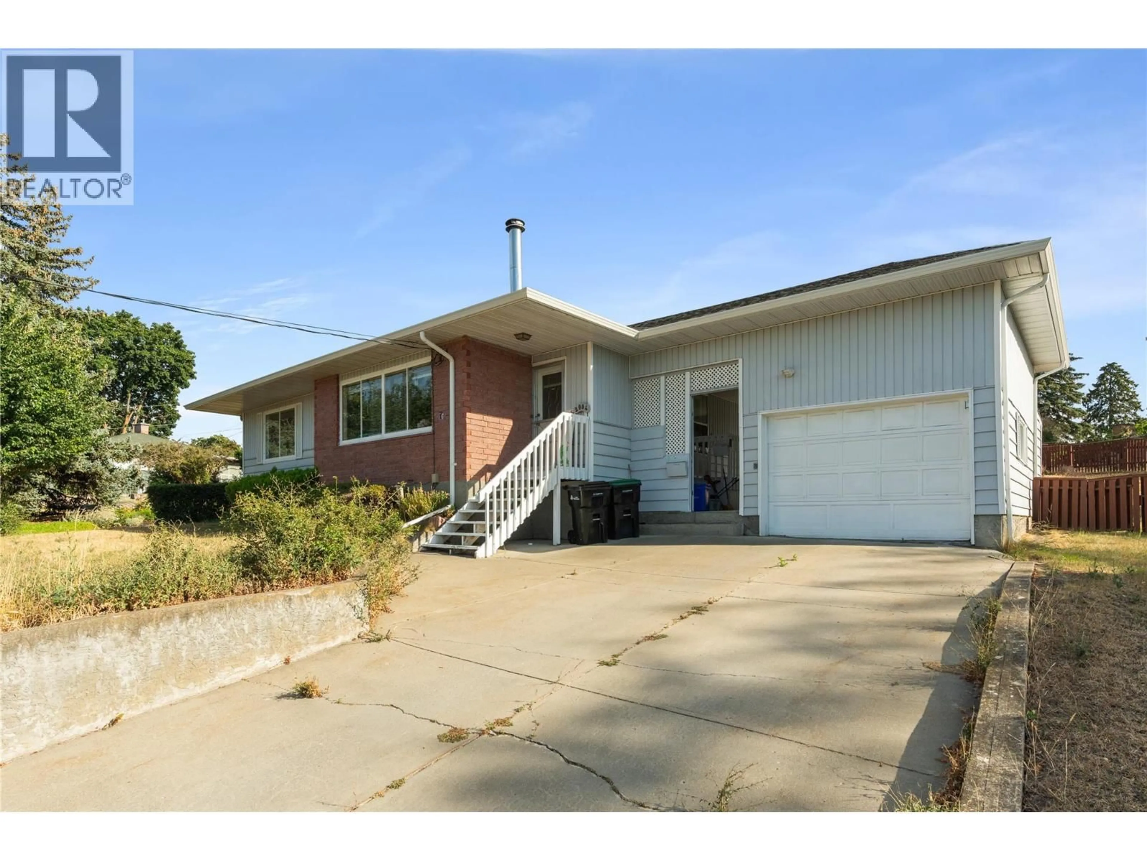 Home with brick exterior material, street for 2004 29TH CRESCENT CRESCENT, Vernon British Columbia V1T1Y5