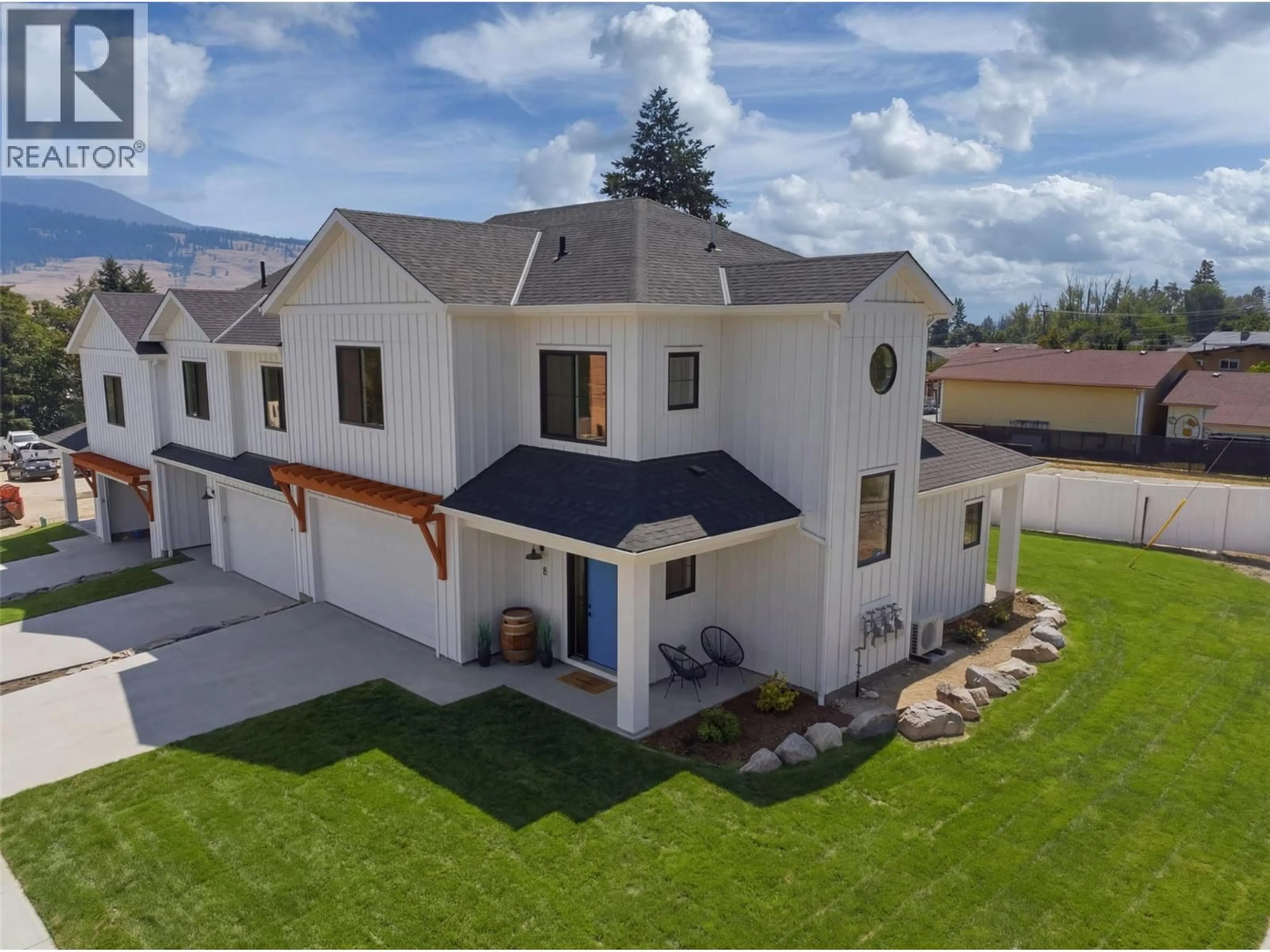 A pic from outside/outdoor area/front of a property/back of a property/a pic from drone, mountain view for 8 - 11565 OKANAGAN CENTRE ROAD EAST, Lake Country British Columbia V4V1G4