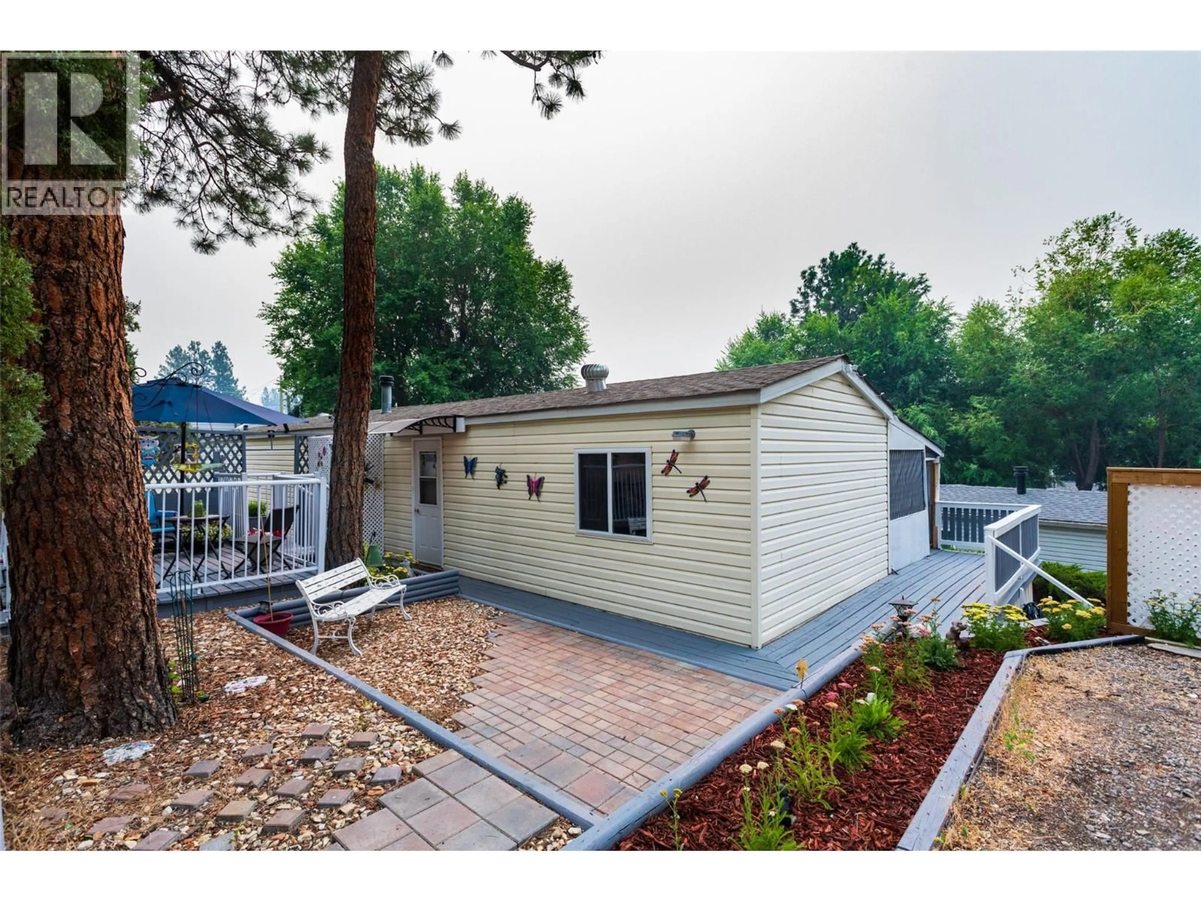 Home with vinyl exterior material, street for 18 - 3206 SHANNON LAKE ROAD, Westbank British Columbia V4T1V4