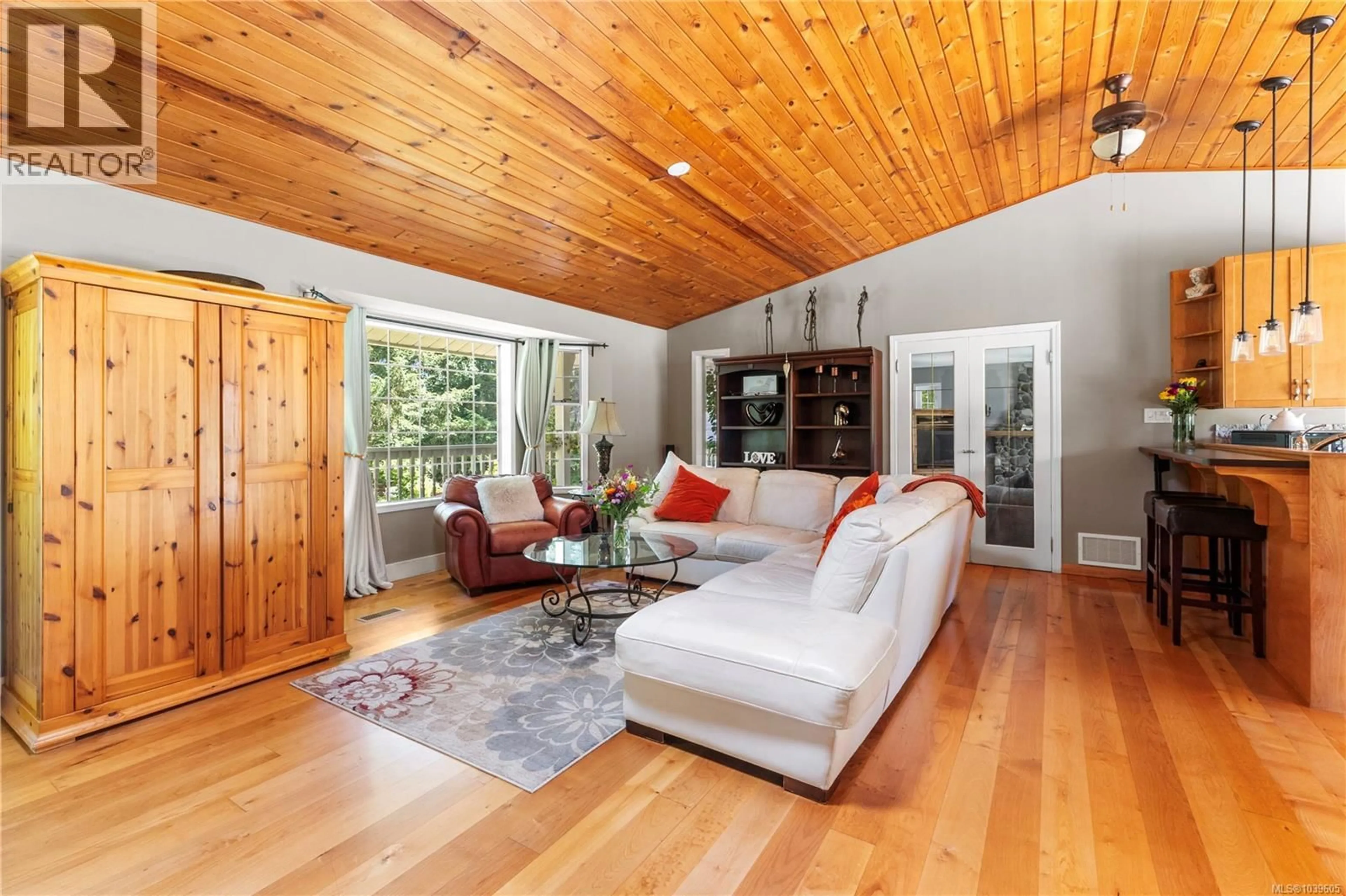 Living room with furniture, wood/laminate floor for 777 SALSBURY ROAD, Courtenay British Columbia V9N9M2