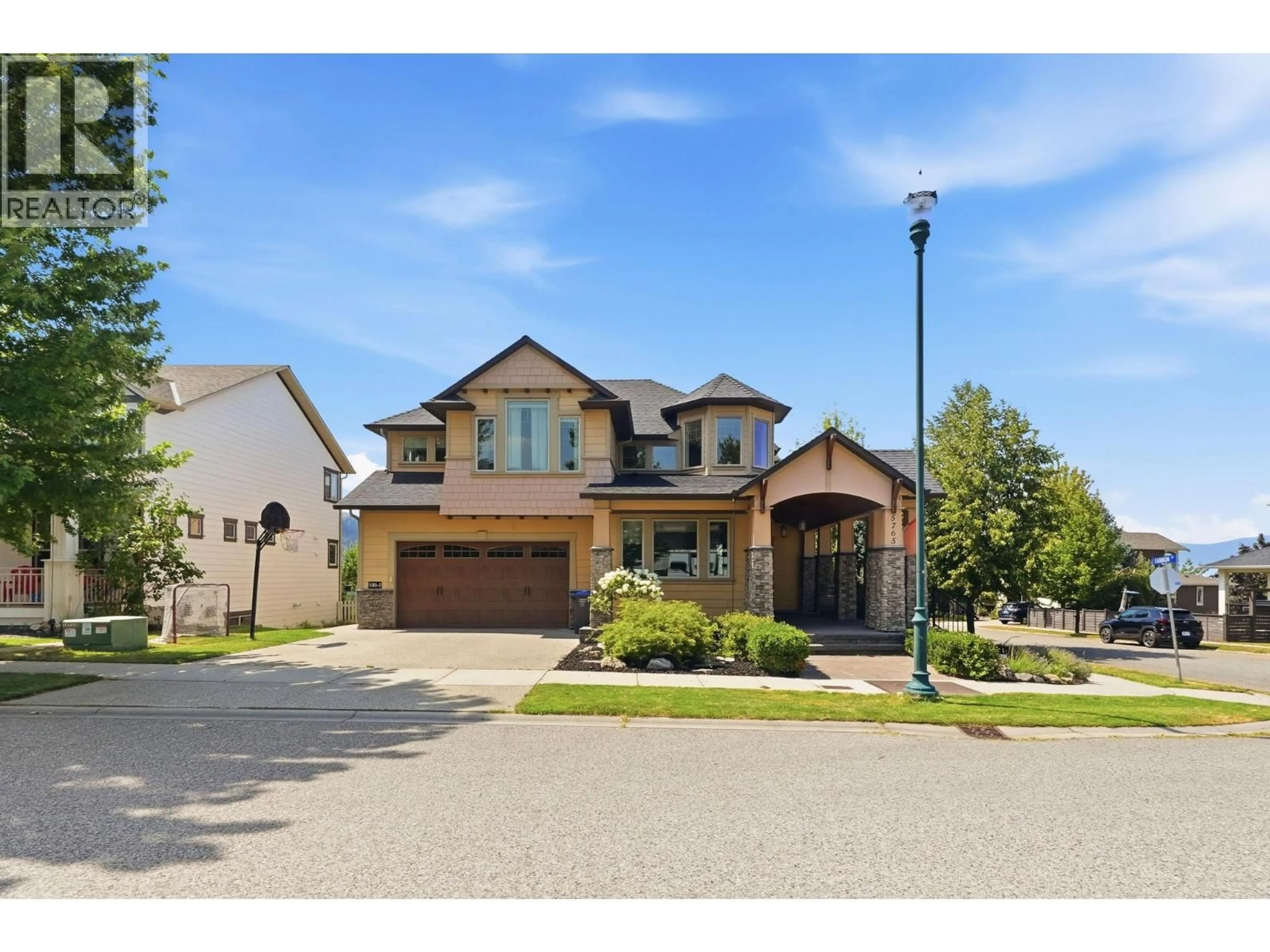 Home with brick exterior material, street for 5765 MOUNTAINSIDE DRIVE, Kelowna British Columbia V1W5H2