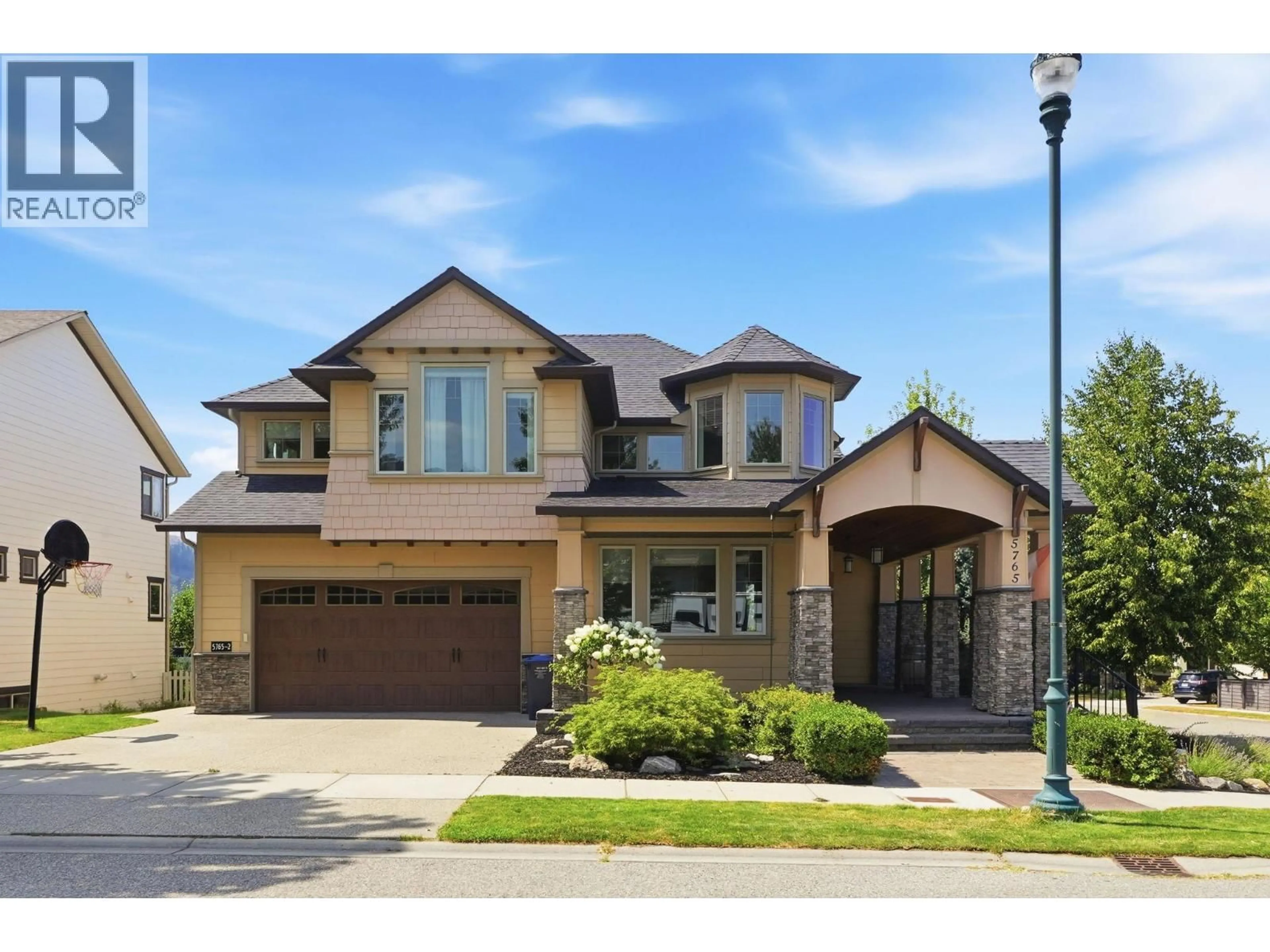 Home with brick exterior material, street for 5765 MOUNTAINSIDE DRIVE, Kelowna British Columbia V1W5H2