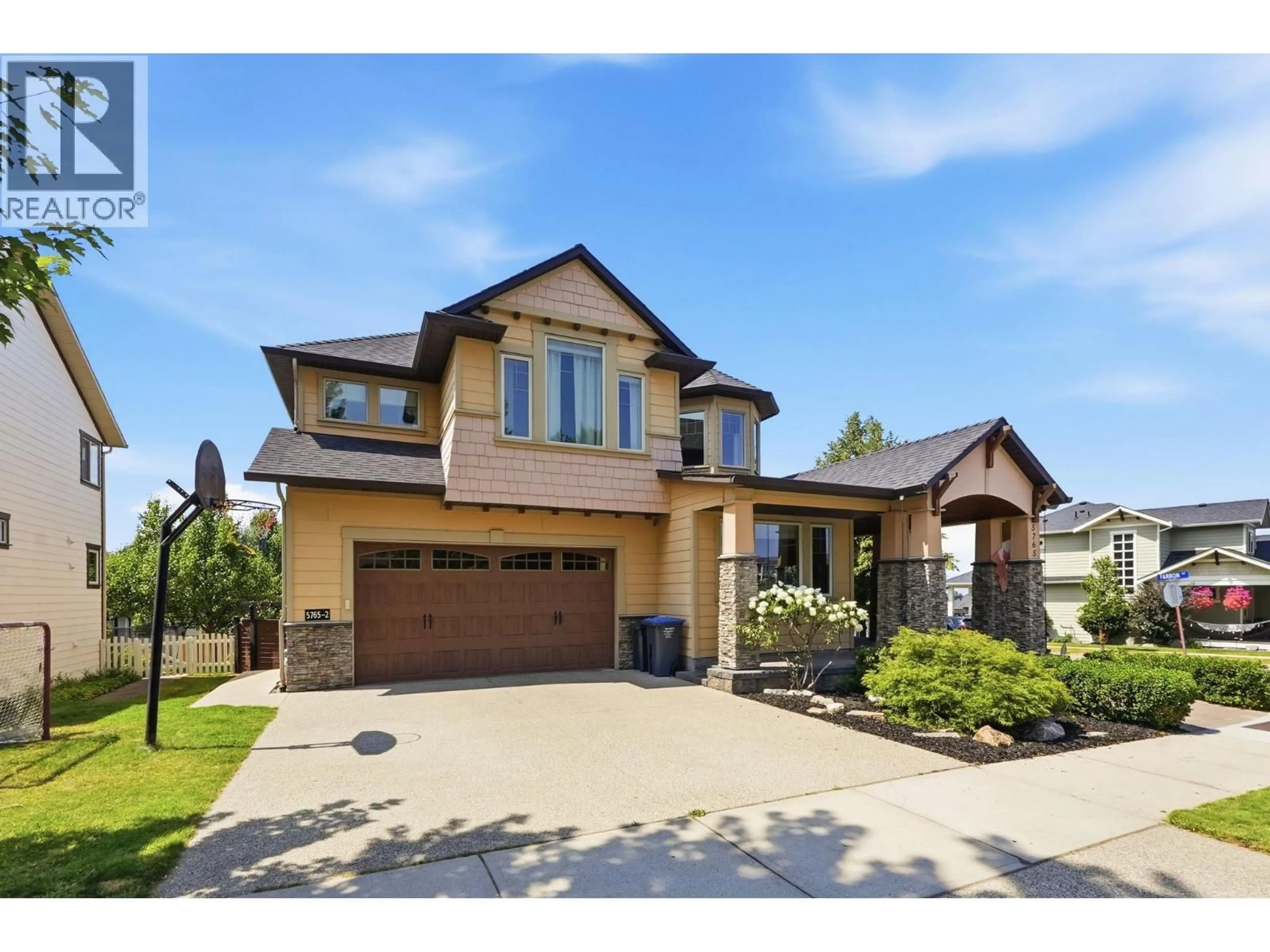 Home with brick exterior material, street for 5765 MOUNTAINSIDE DRIVE, Kelowna British Columbia V1W5H2