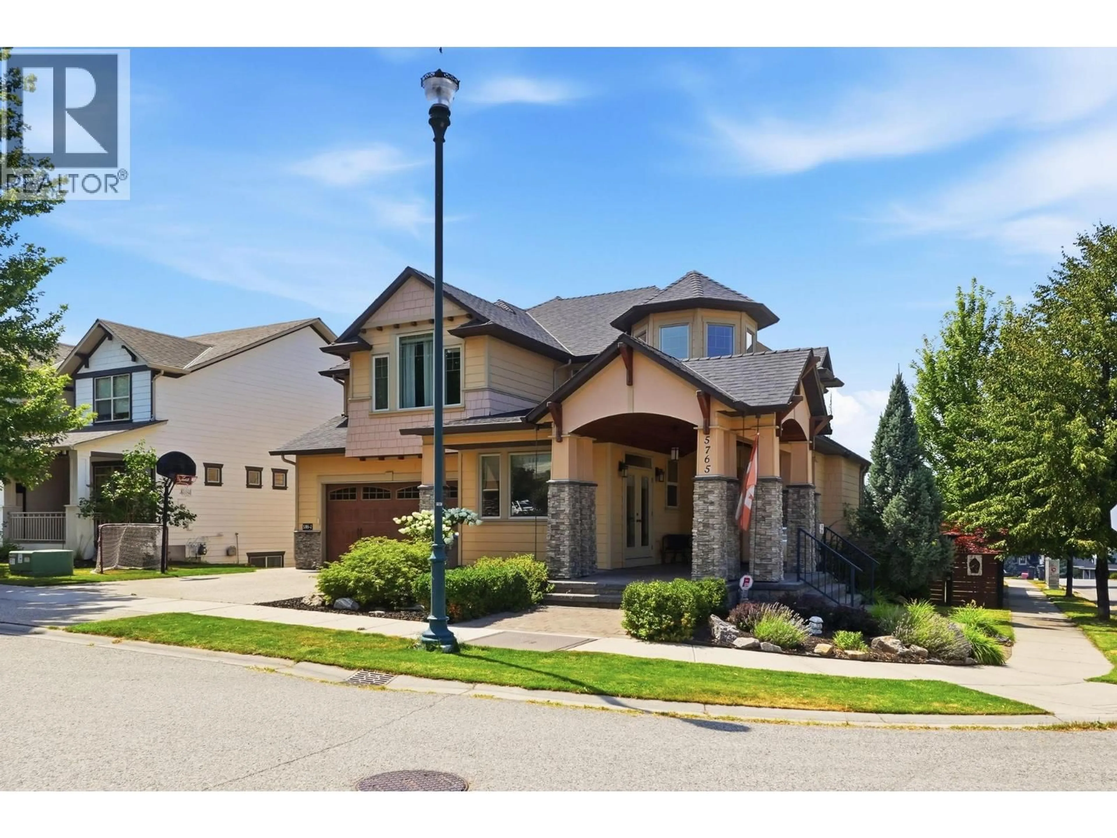 Home with brick exterior material, street for 5765 MOUNTAINSIDE DRIVE, Kelowna British Columbia V1W5H2