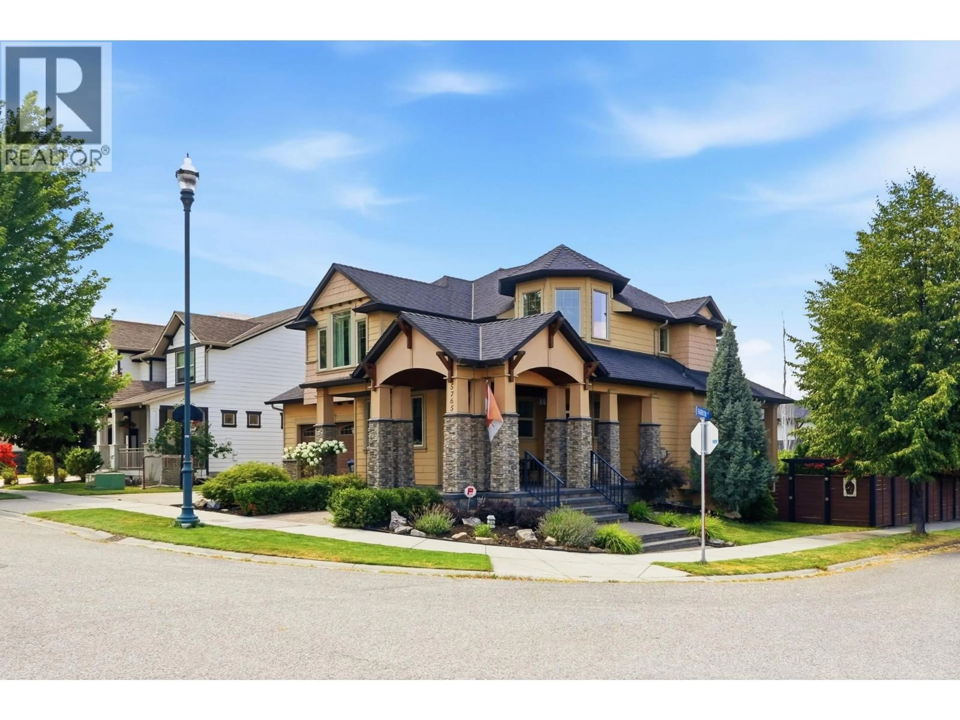 Home with brick exterior material, street for 5765 MOUNTAINSIDE DRIVE, Kelowna British Columbia V1W5H2