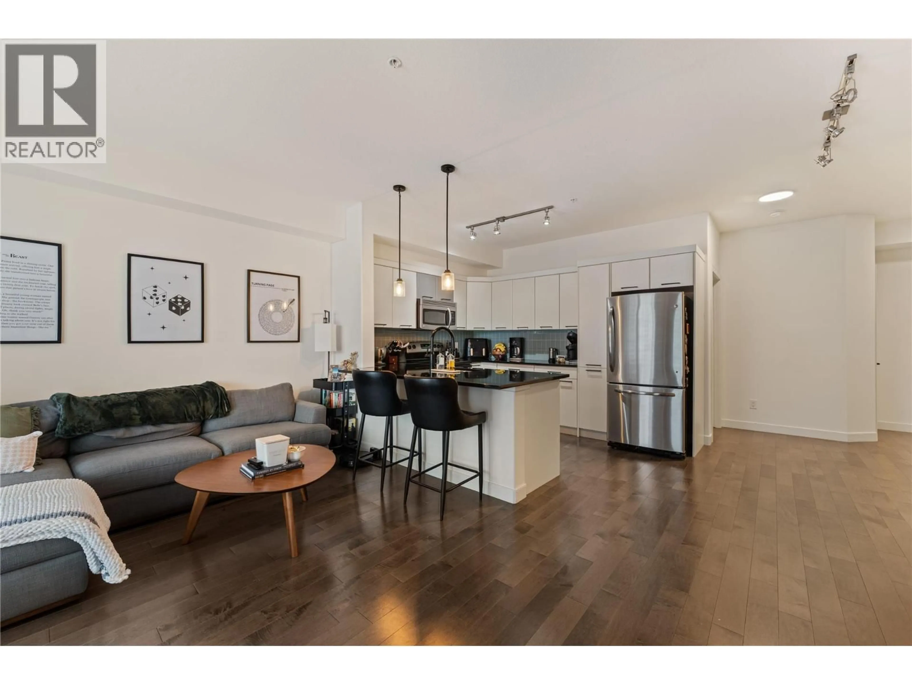 Open concept kitchen, wood/laminate floor for 310 - 3645 CARRINGTON ROAD, West Kelowna British Columbia V4T3G9
