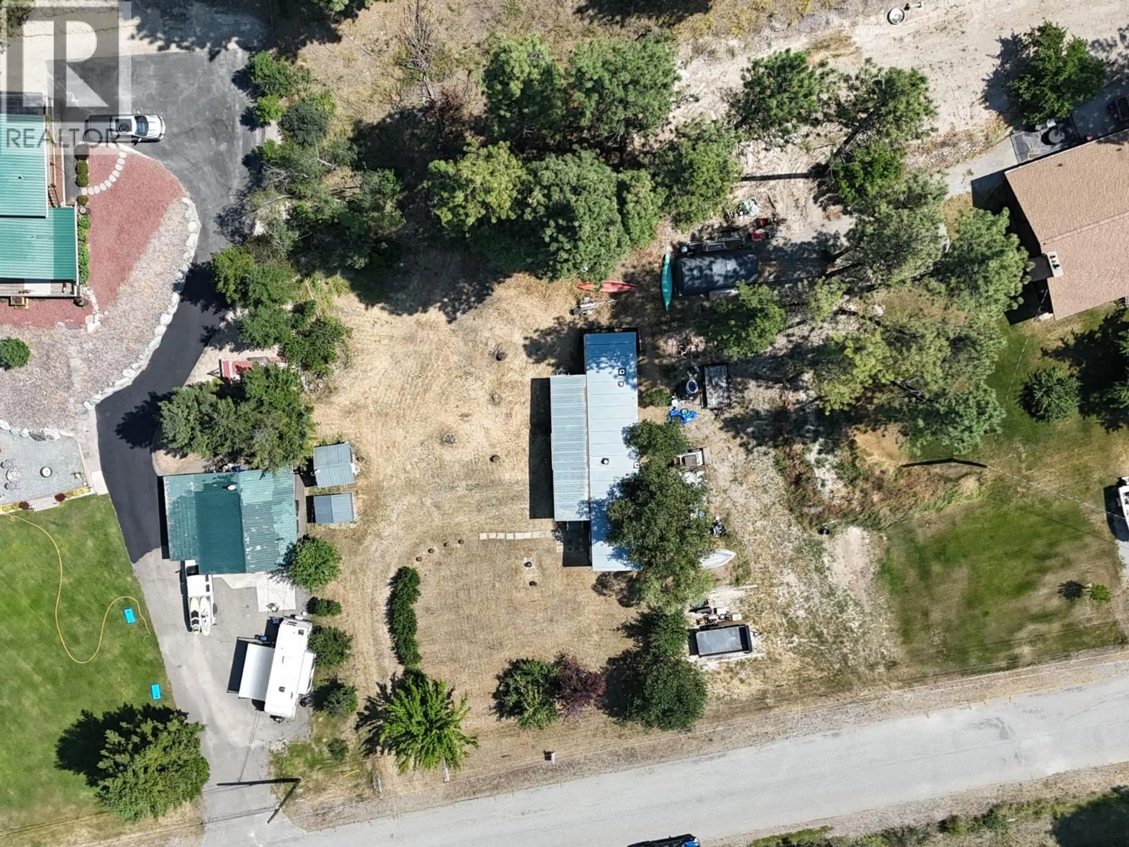A pic from outside/outdoor area/front of a property/back of a property/a pic from drone, street for 6294 ASH ROAD, Wasa British Columbia V0B2K0