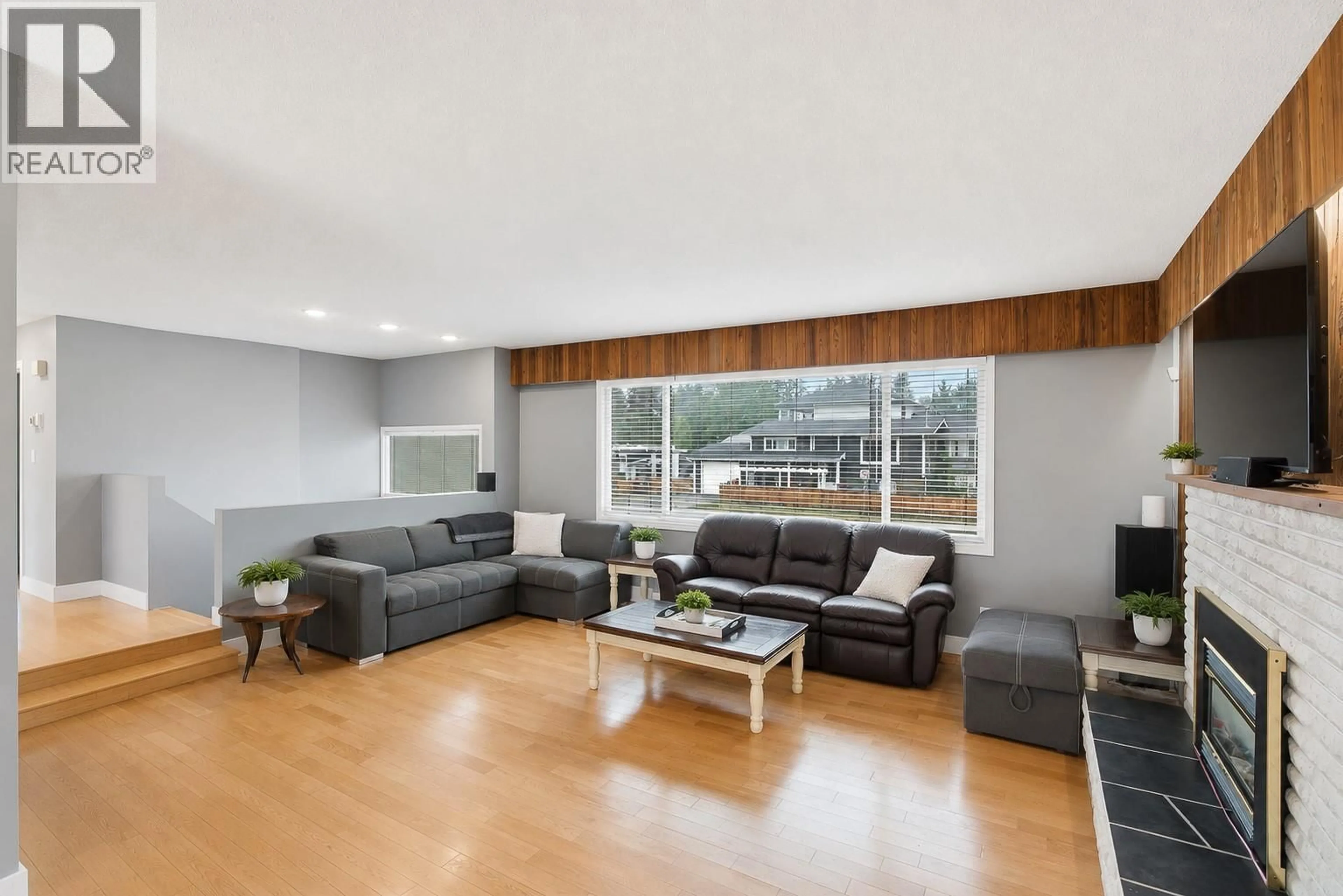 Living room with furniture, wood/laminate floor for 1801 HAMILTON AVENUE, Merritt British Columbia V1K1B8