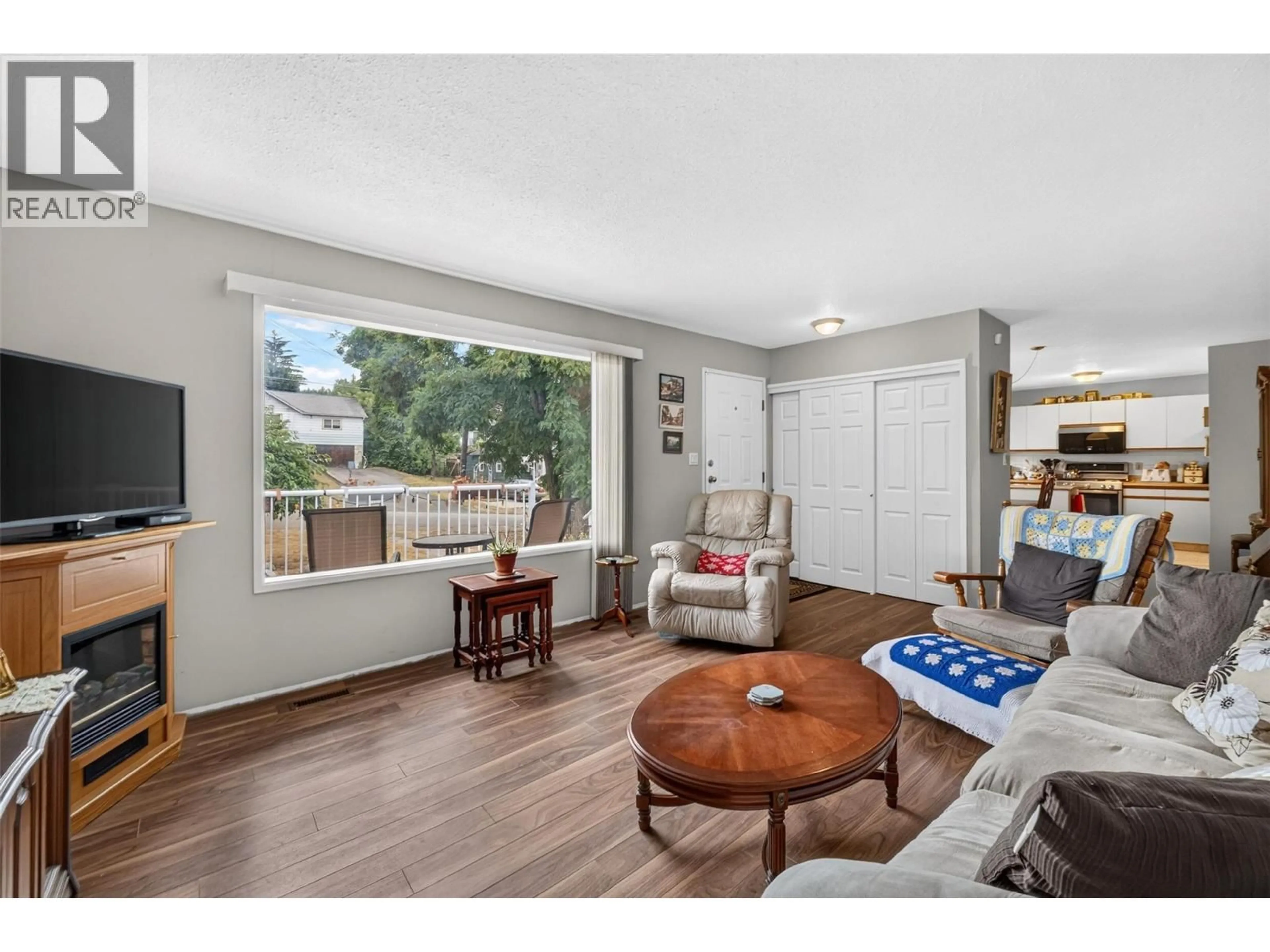 Living room with furniture, wood/laminate floor for 341 2 STREET SOUTHEAST, Salmon Arm British Columbia V1E4H3