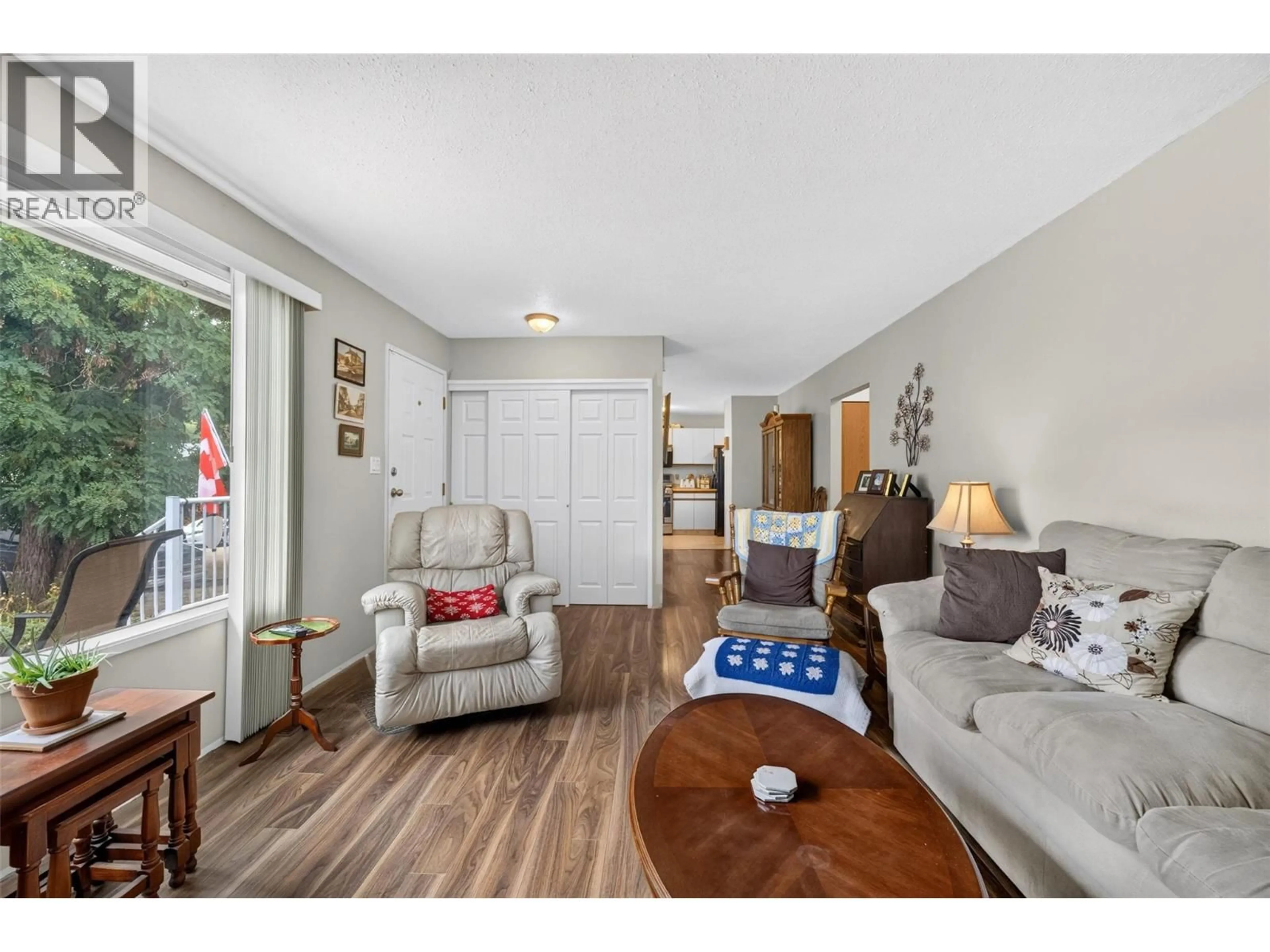 Living room with furniture, wood/laminate floor for 341 2 STREET SOUTHEAST, Salmon Arm British Columbia V1E4H3
