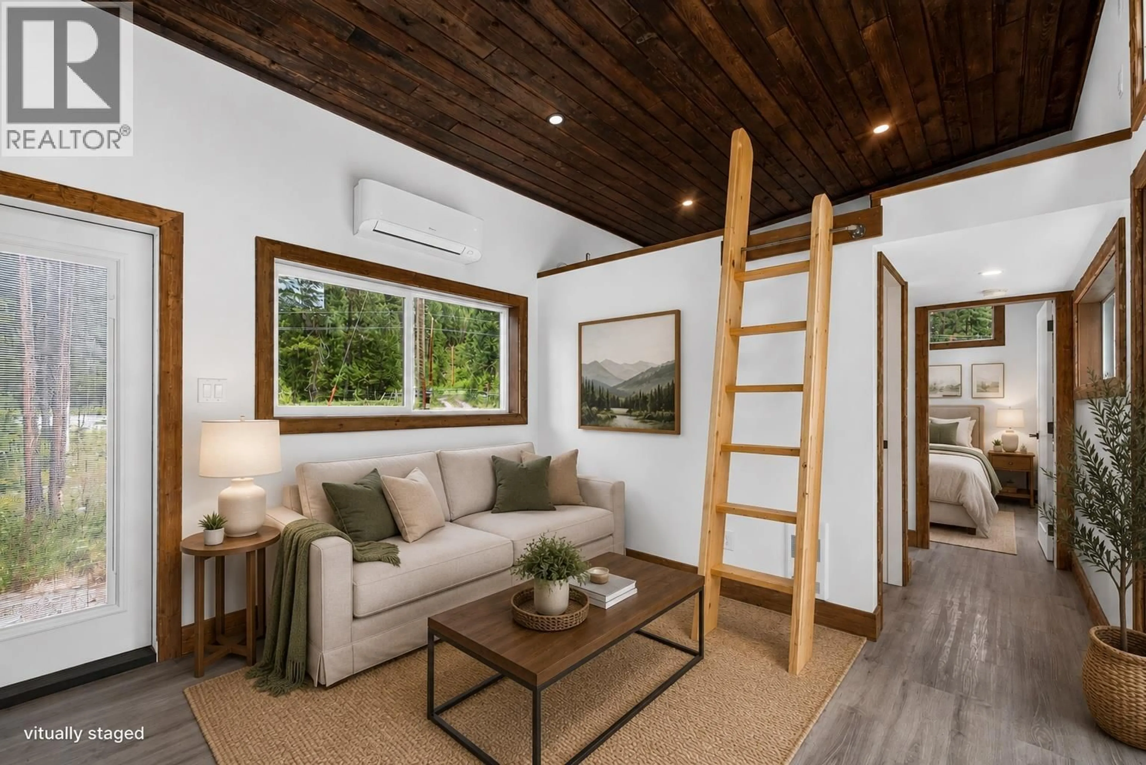 Living room with furniture, wood/laminate floor for 1 - 5533 33 HIGHWAY, Beaverdell British Columbia V0H1A0