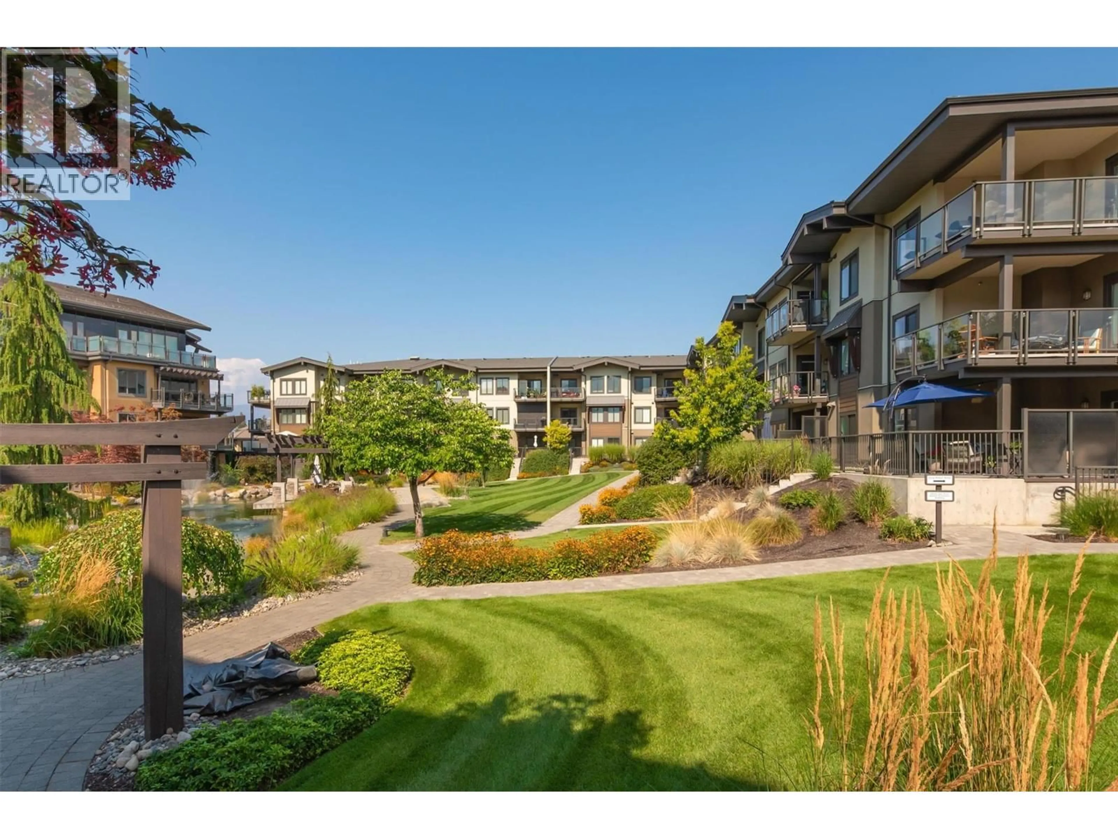 A pic from outside/outdoor area/front of a property/back of a property/a pic from drone, water/lake/river/ocean view for 225 - 4380 LAKESHORE ROAD, Kelowna British Columbia V1W5N3