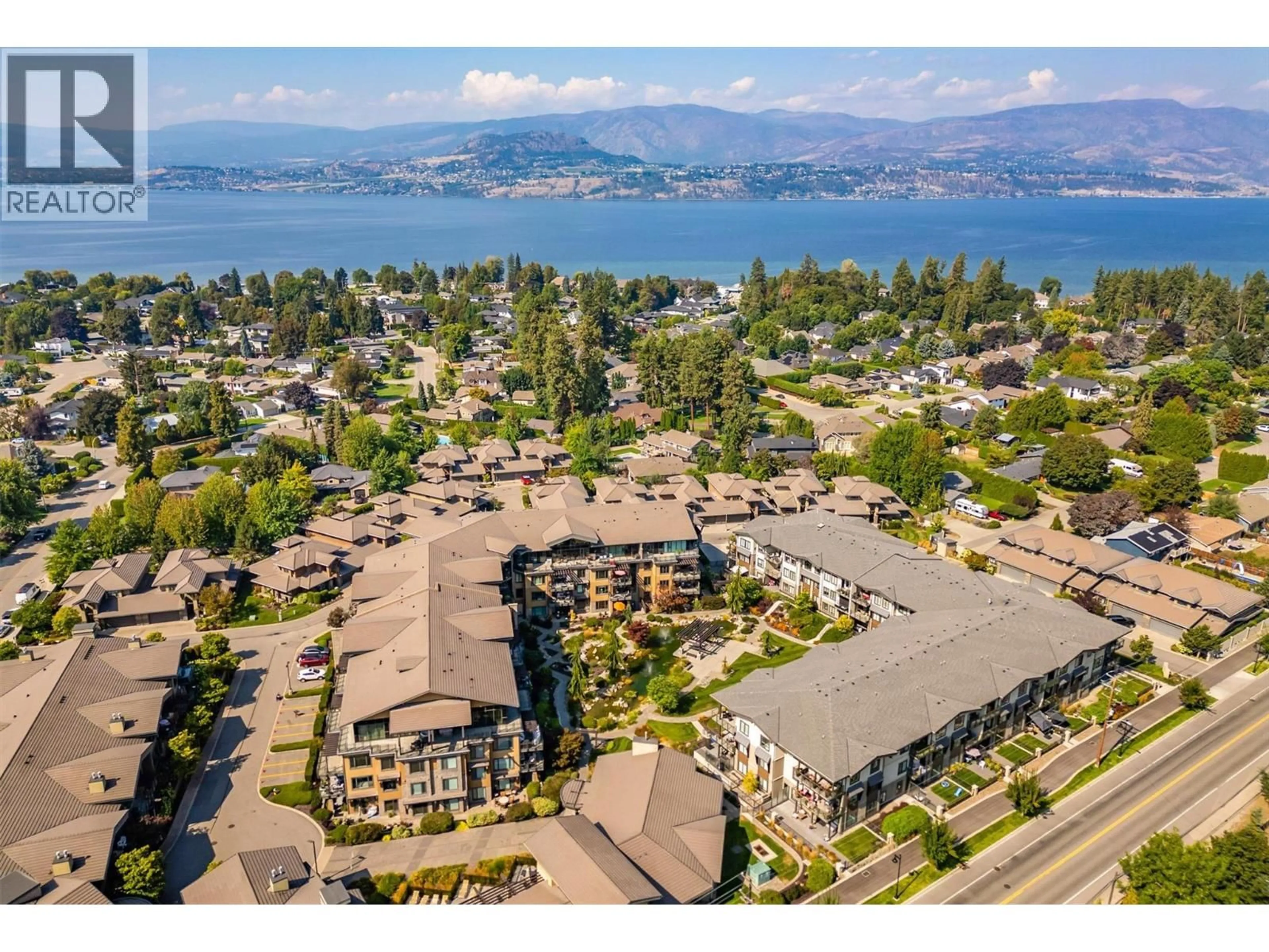 A pic from outside/outdoor area/front of a property/back of a property/a pic from drone, water/lake/river/ocean view for 225 - 4380 LAKESHORE ROAD, Kelowna British Columbia V1W5N3