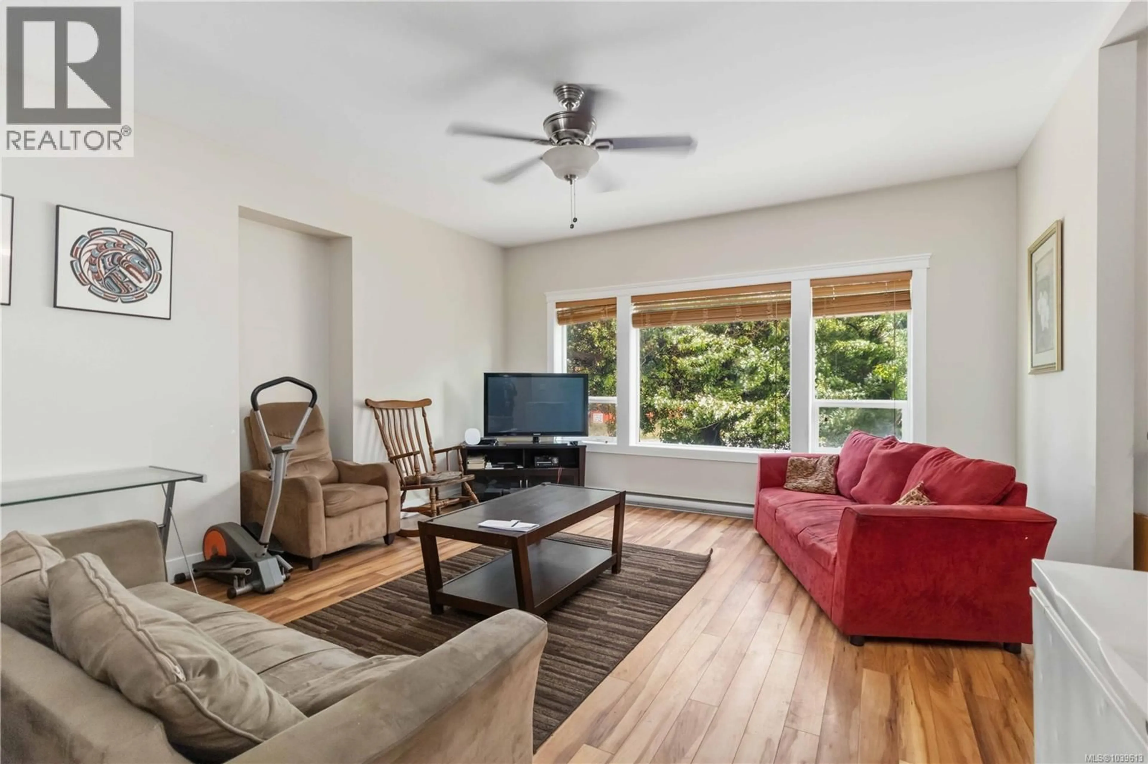 Living room with furniture, wood/laminate floor for 2616 SOOKE ROAD, Langford British Columbia V9C1Y6