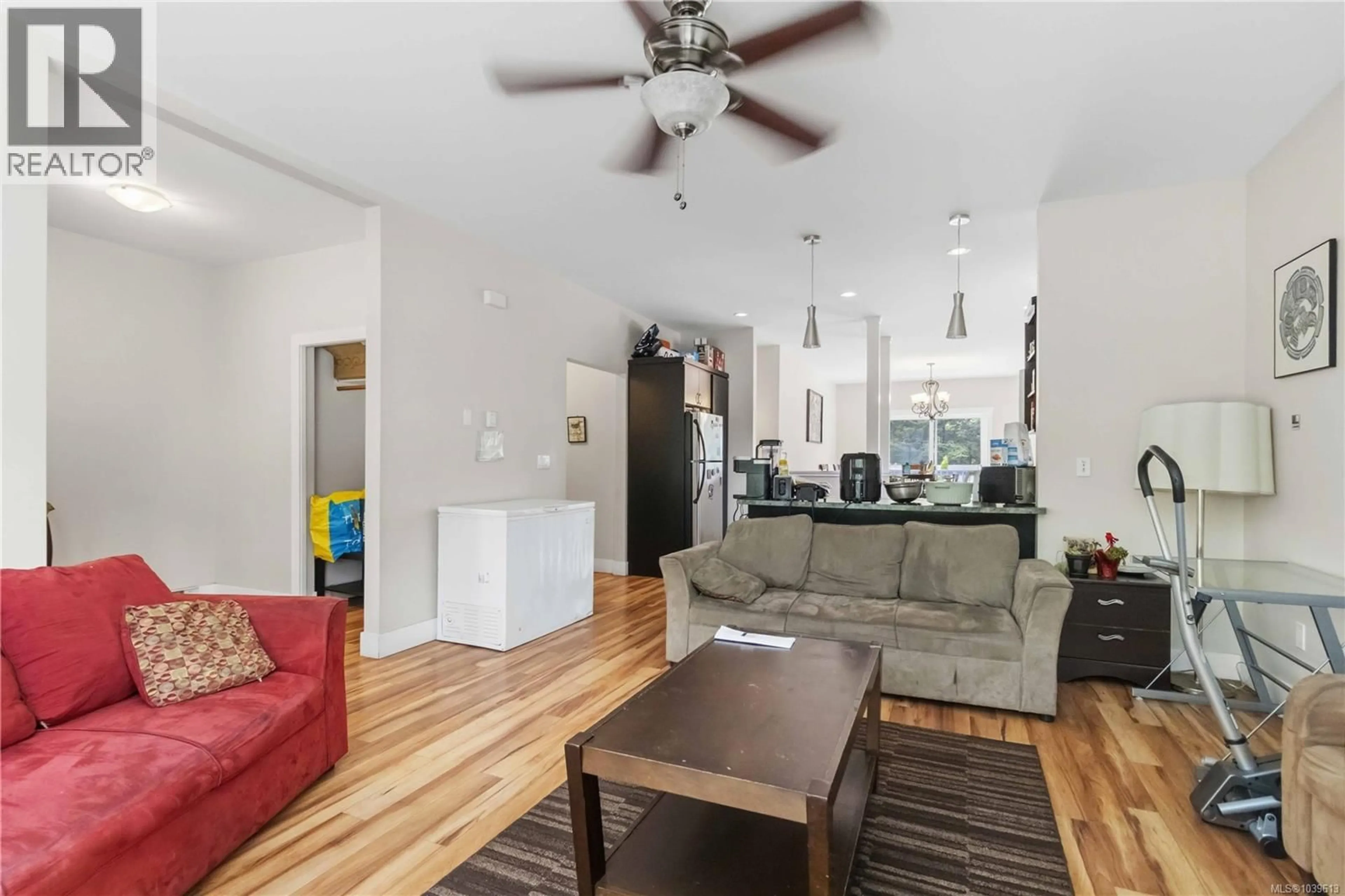 Living room with furniture, wood/laminate floor for 2616 SOOKE ROAD, Langford British Columbia V9C1Y6