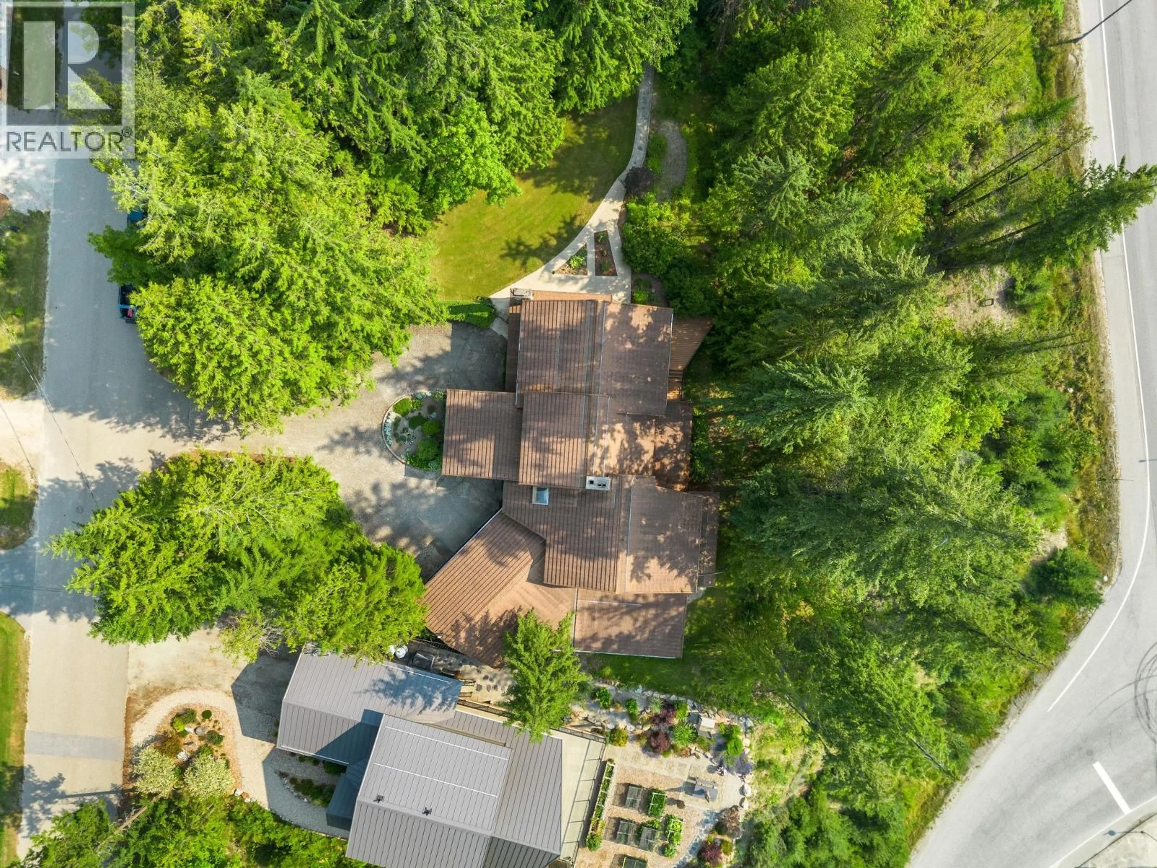 A pic from outside/outdoor area/front of a property/back of a property/a pic from drone, forest/trees view for 231 GLENACRES ROAD, Nakusp British Columbia V0G1R0