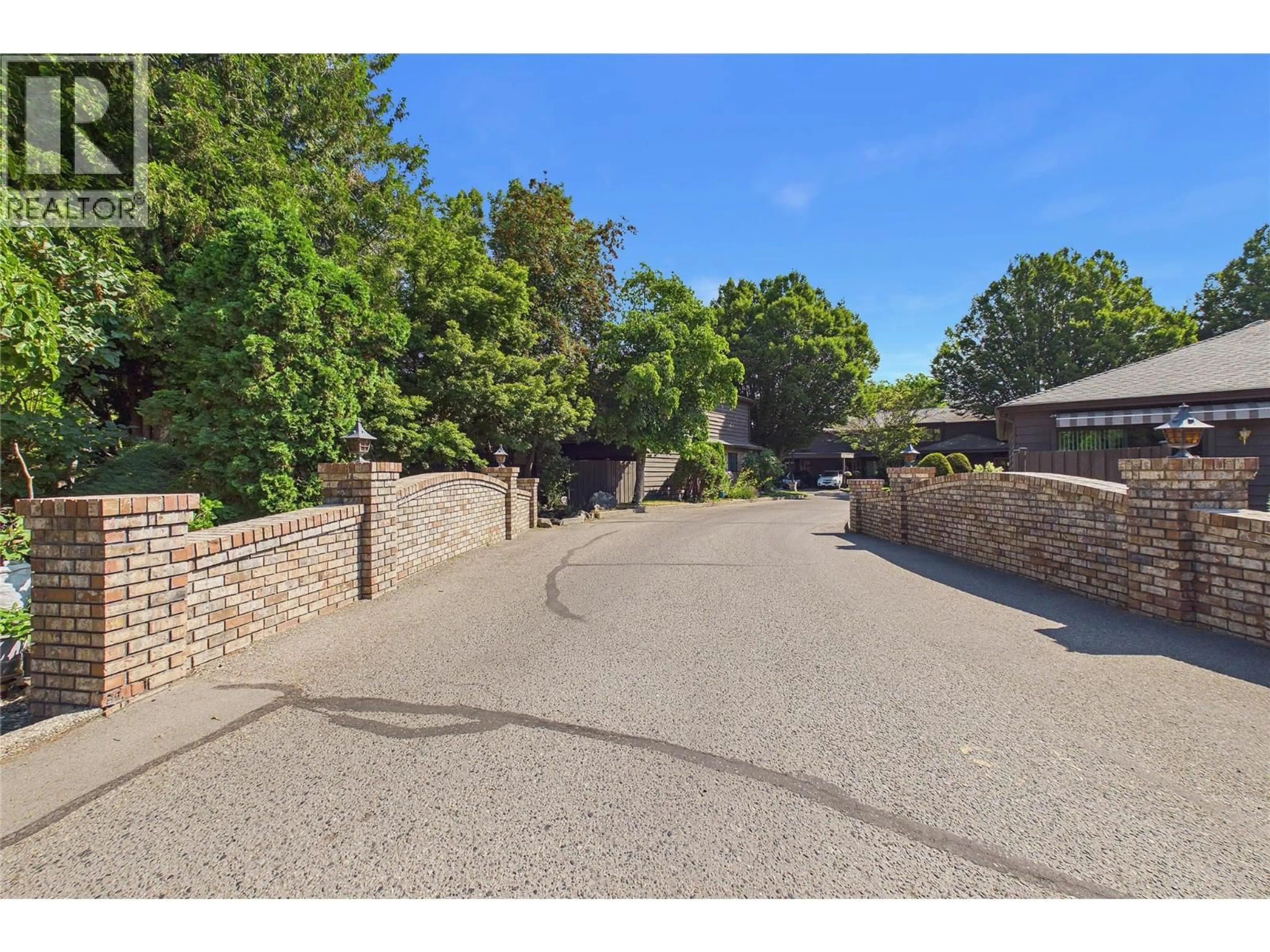 A pic from outside/outdoor area/front of a property/back of a property/a pic from drone, street for 162 - 1995 BURTCH ROAD, Kelowna British Columbia V1Y4B4
