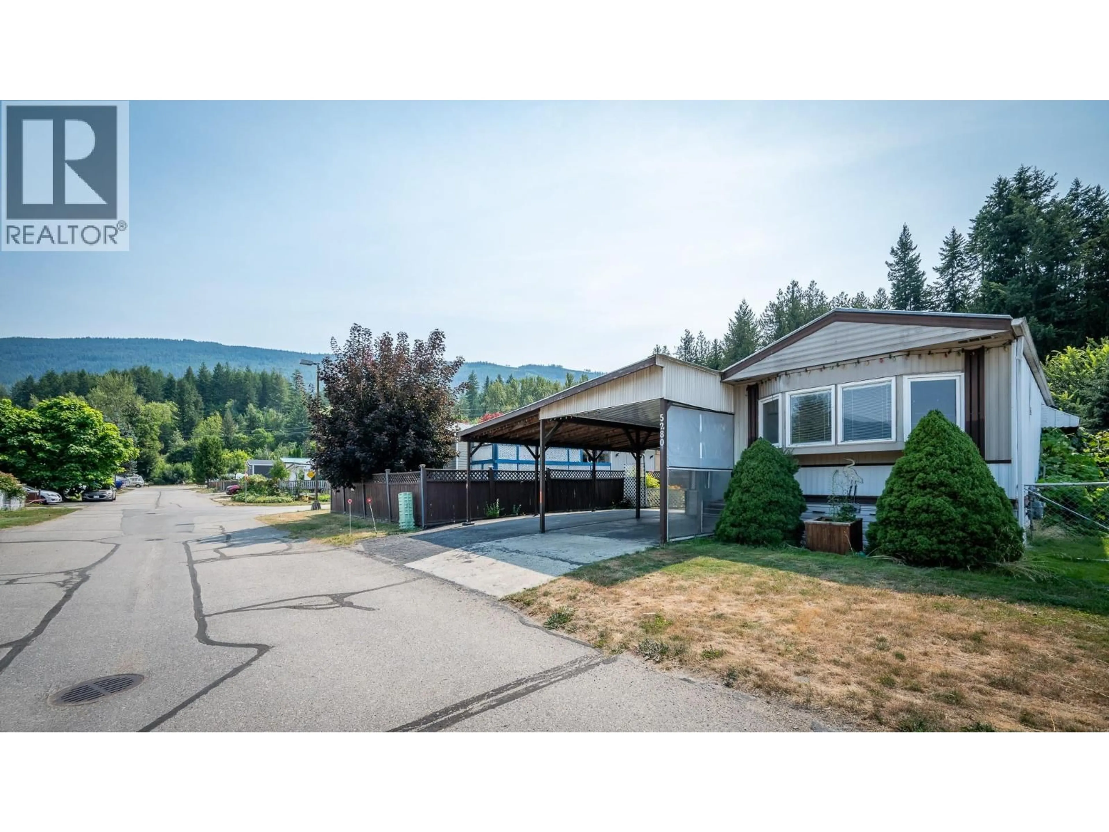 Home with vinyl exterior material, mountain view for 5280 69 AVENUE NORTHEAST, Salmon Arm British Columbia V0E1K0