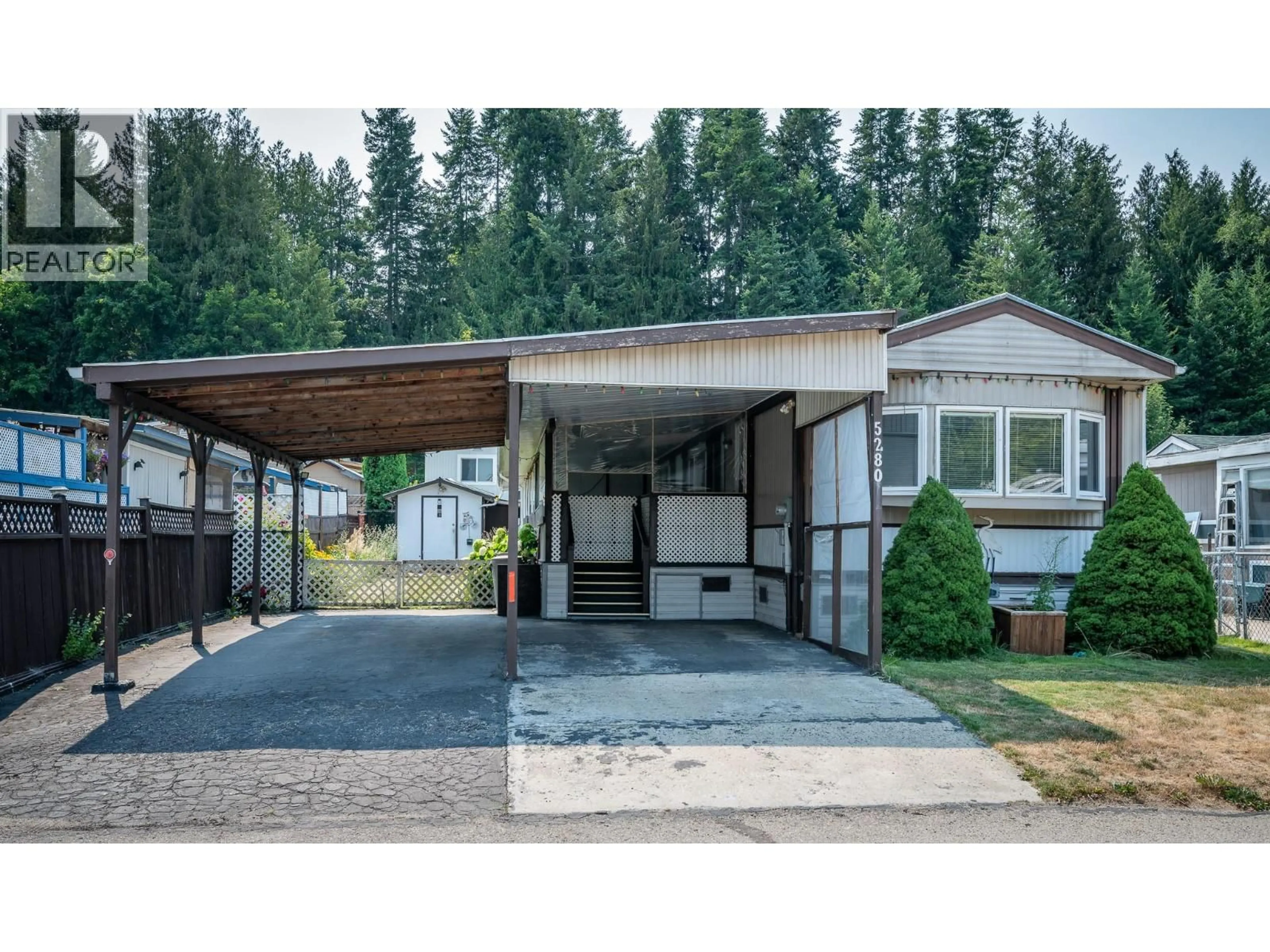 Home with vinyl exterior material, street for 5280 69 AVENUE NORTHEAST, Salmon Arm British Columbia V0E1K0