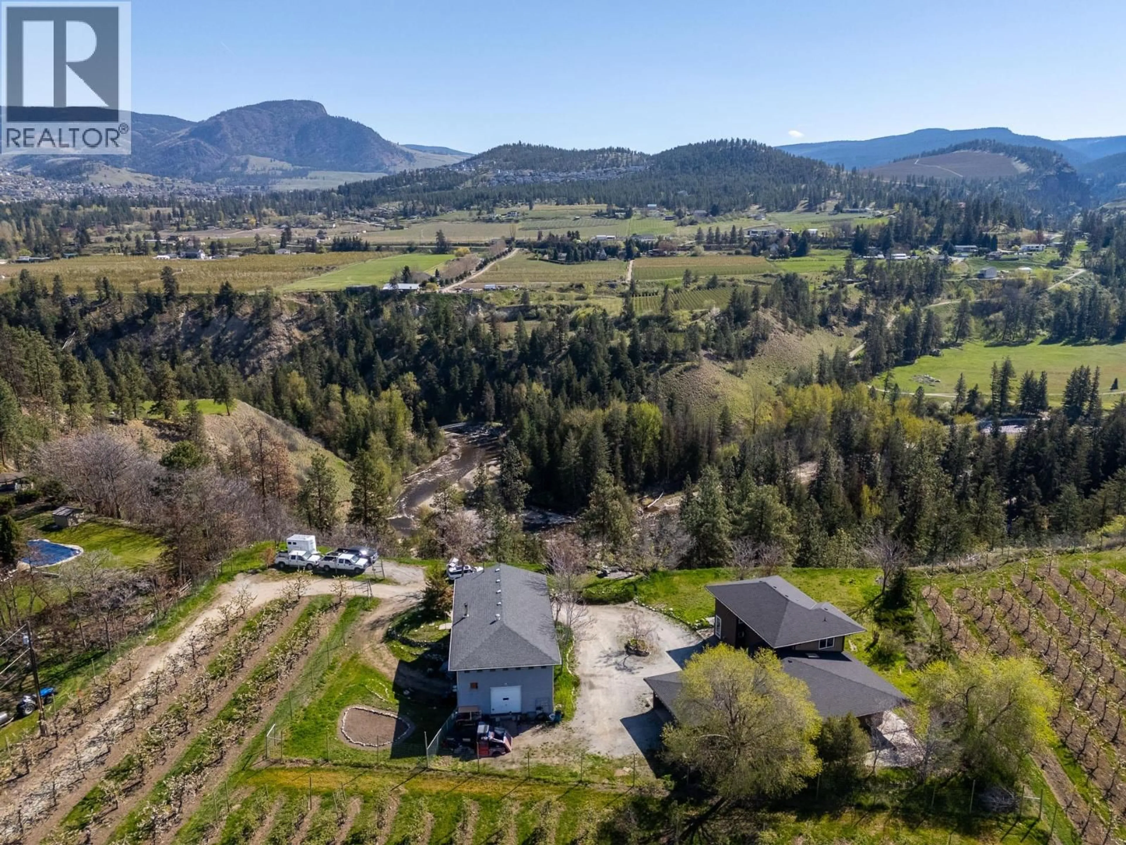 A pic from outside/outdoor area/front of a property/back of a property/a pic from drone, mountain view for 3547 BEMROSE ROAD, Kelowna British Columbia V1W4G8