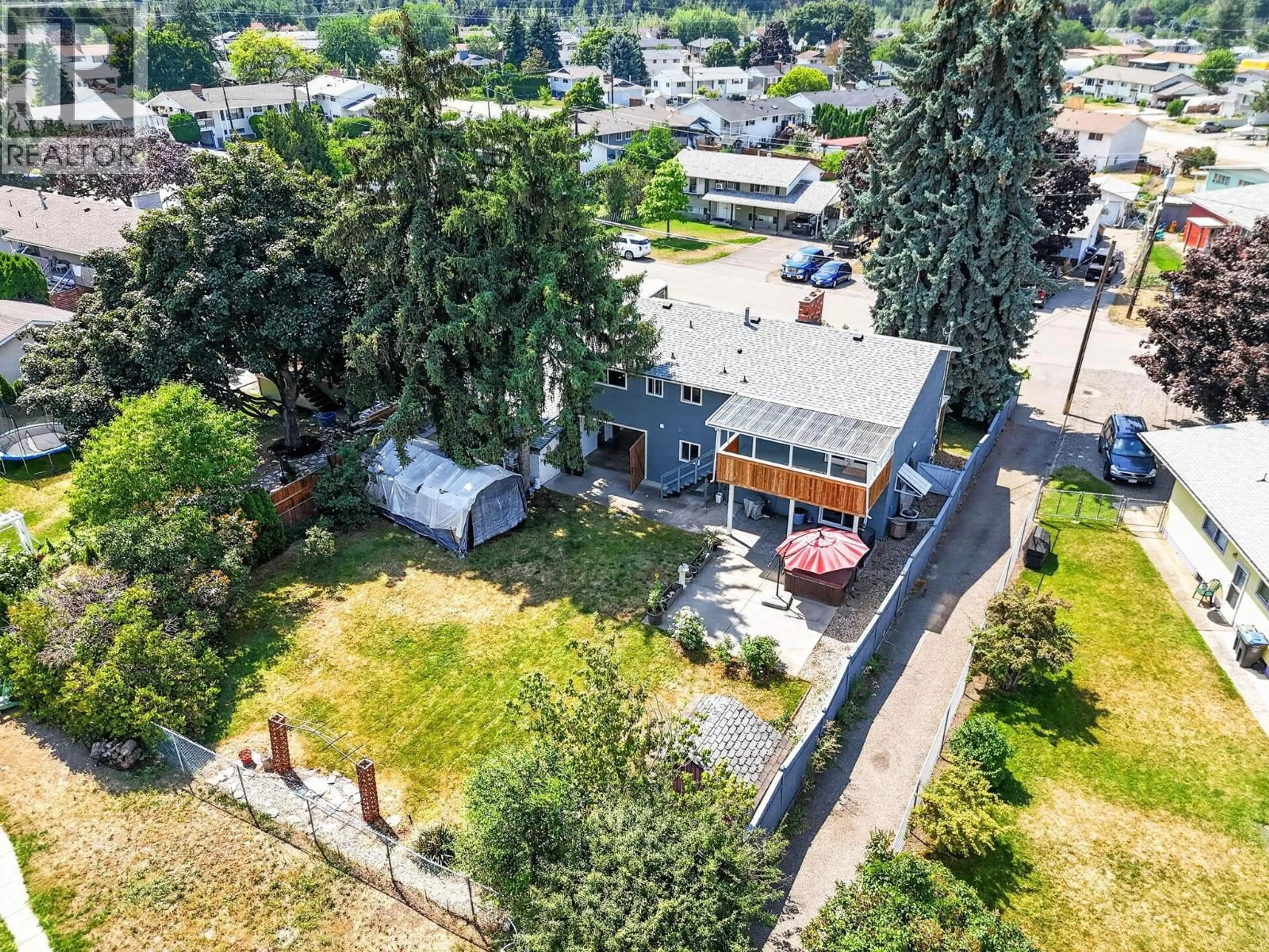 A pic from outside/outdoor area/front of a property/back of a property/a pic from drone, street for 1045 MITCHELL ROAD, Kelowna British Columbia V1X3W7