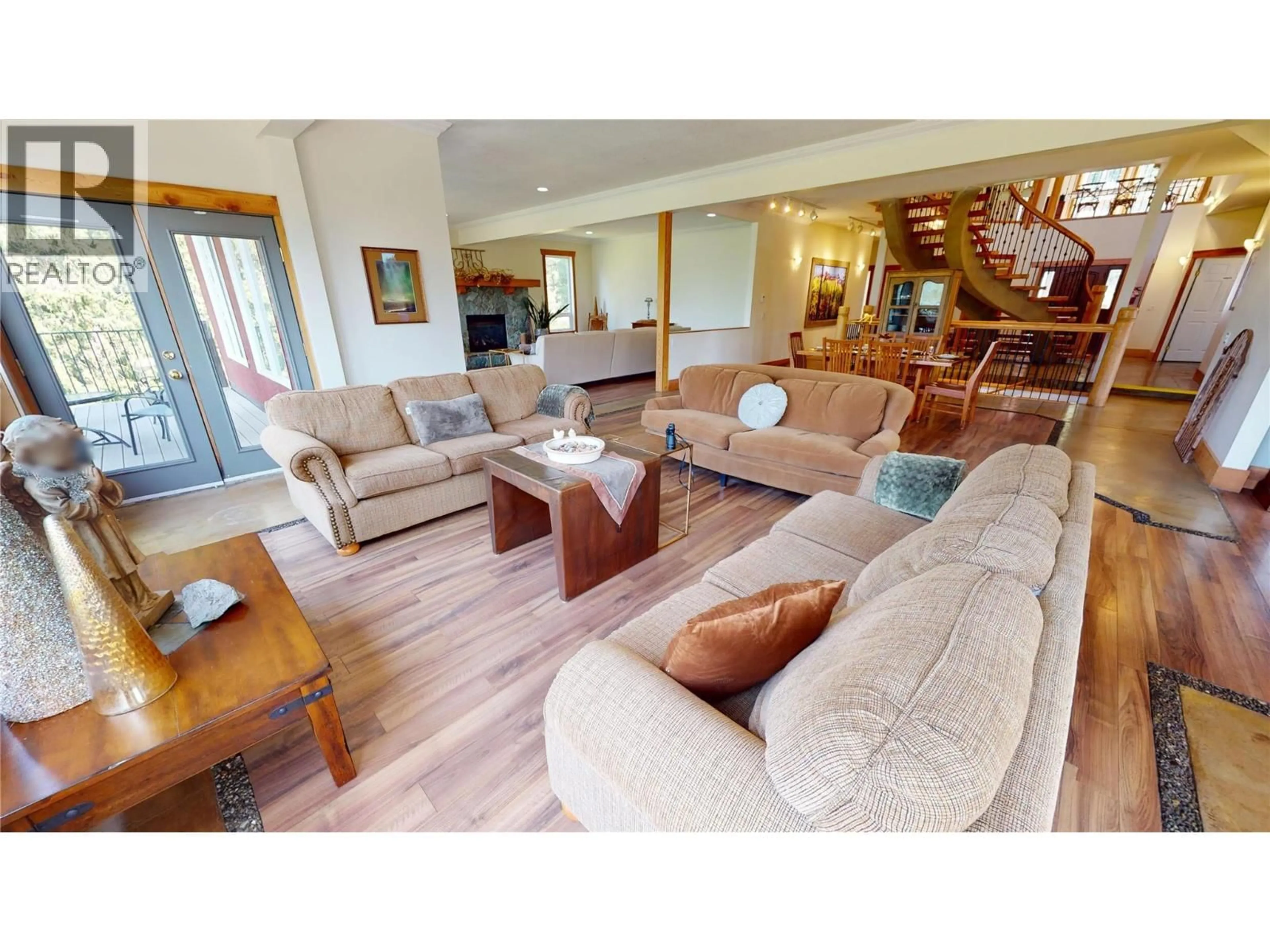 Living room with furniture, wood/laminate floor for 3934 COKATO ROAD, Fernie British Columbia V0B1M4