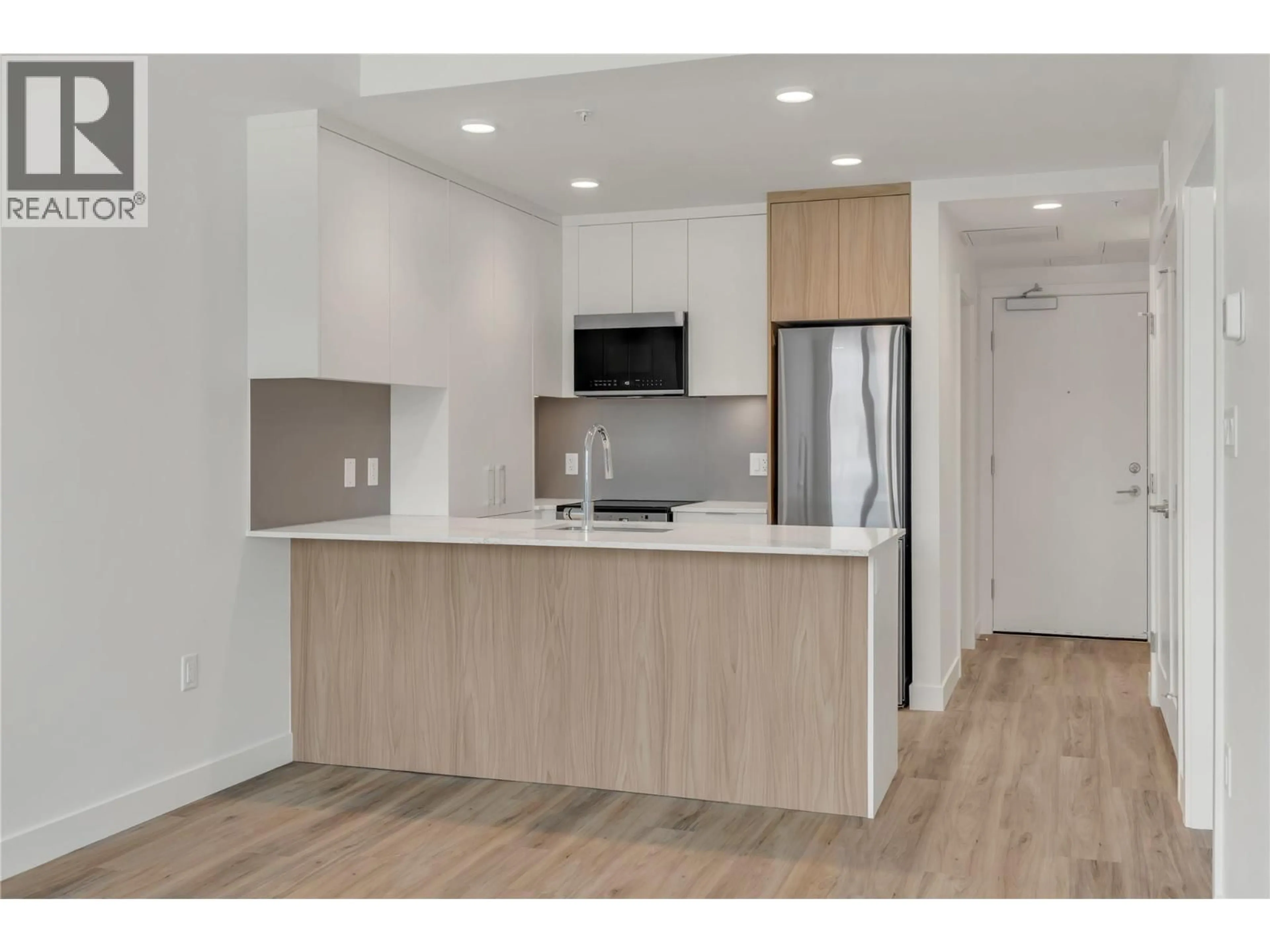 Open concept kitchen, wood/laminate floor for 315 - 271 WYLIE STREET, Penticton British Columbia V2A9C9