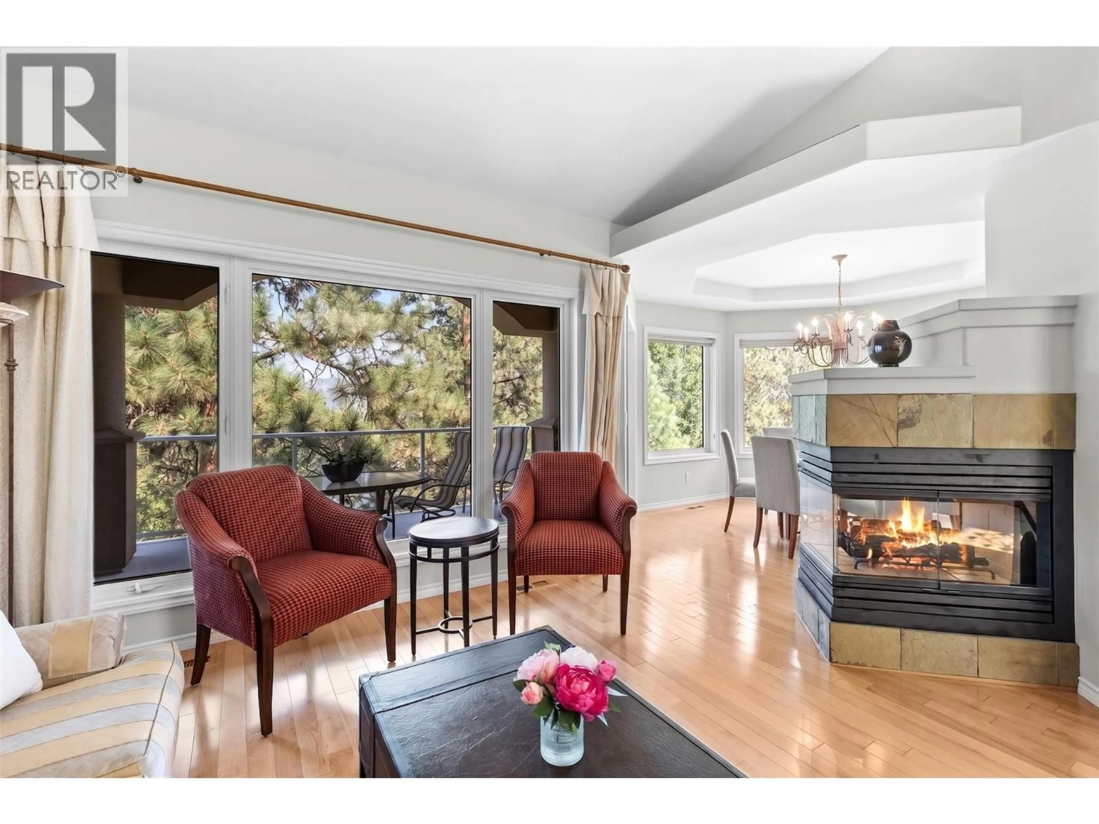 Living room with furniture, wood/laminate floor for 2 - 4400 GALLAGHERS DRIVE EAST, Kelowna British Columbia V1W3Z8