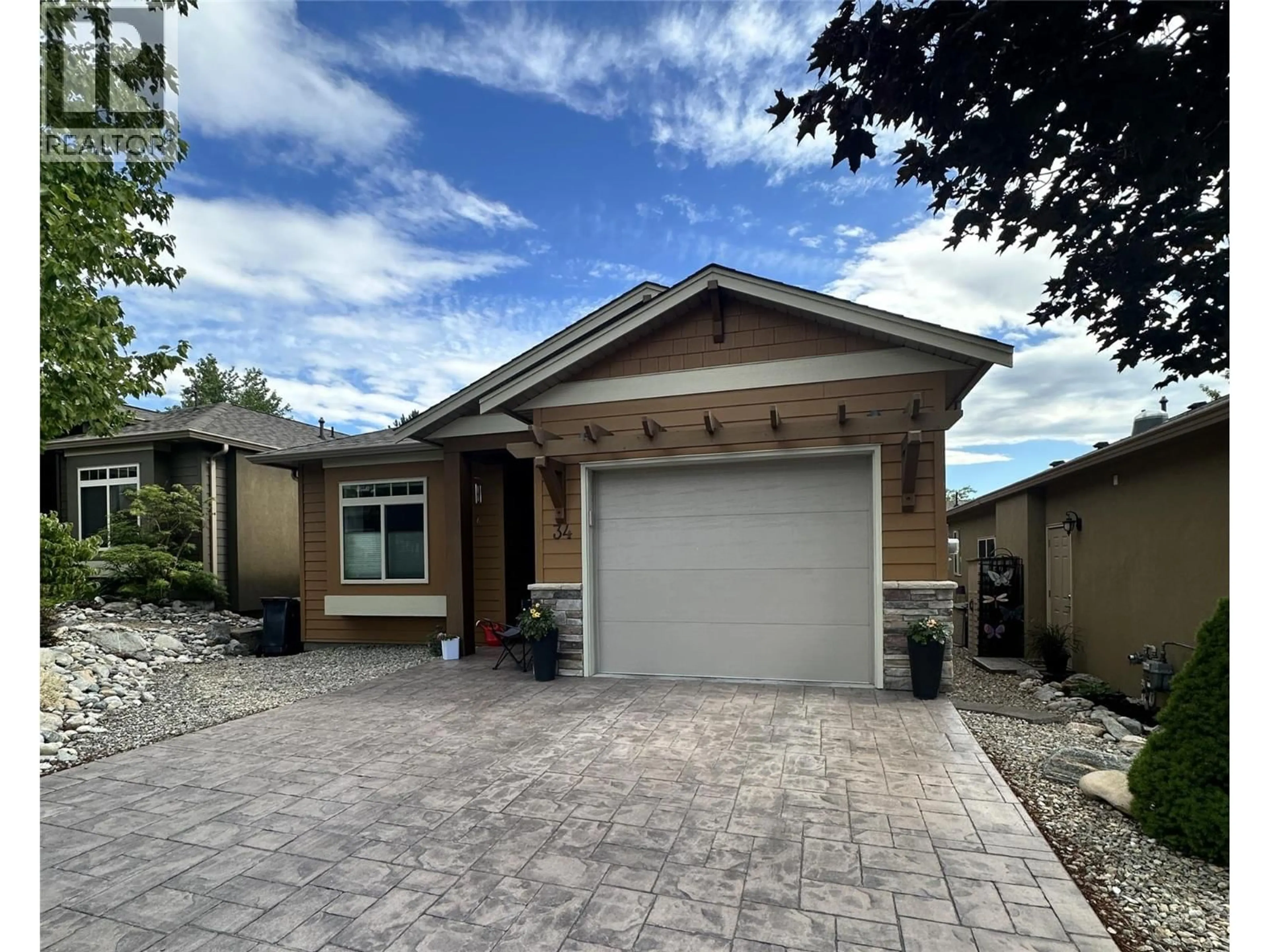 Home with vinyl exterior material, street for 34 - 6833 MEADOWS DRIVE, Oliver British Columbia V0H1T4
