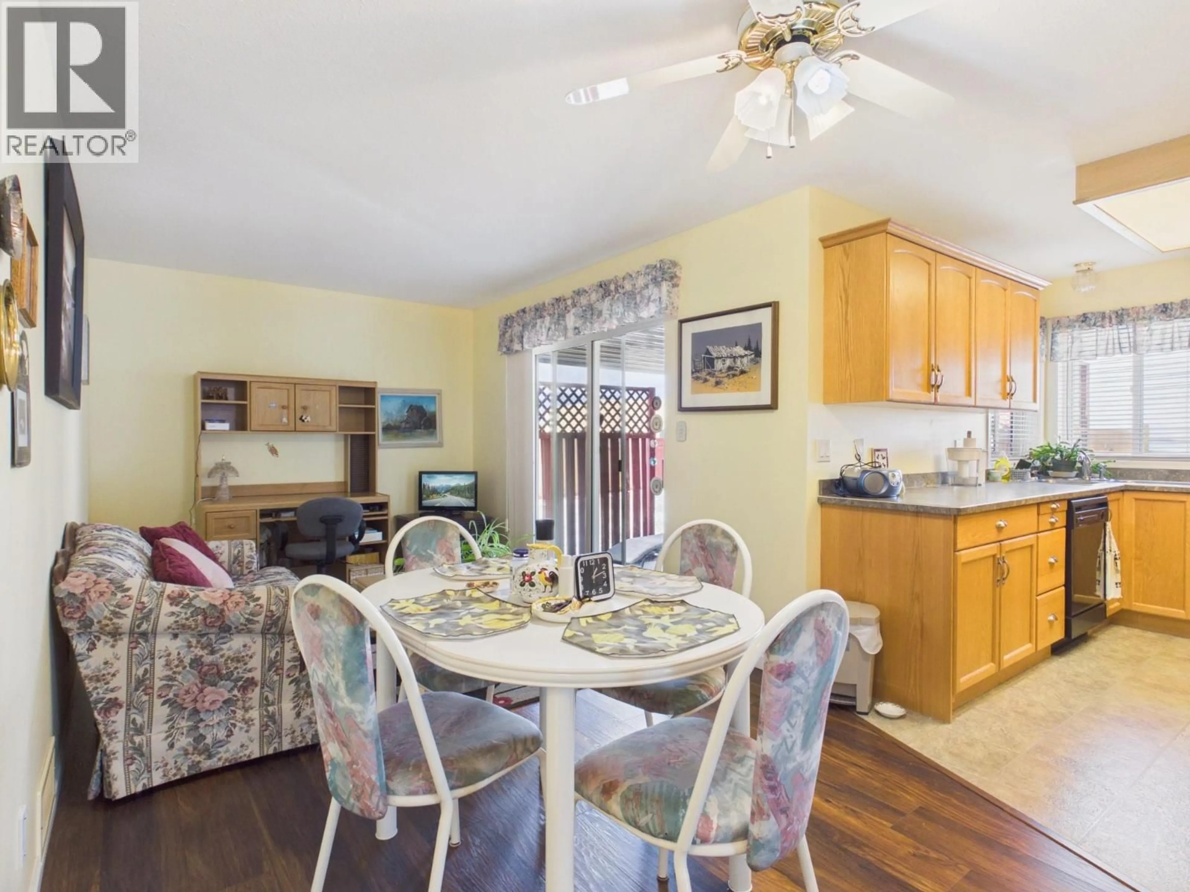Dining room, wood/laminate floor for 14 POPLAR COURT, Osoyoos British Columbia V0H1V5