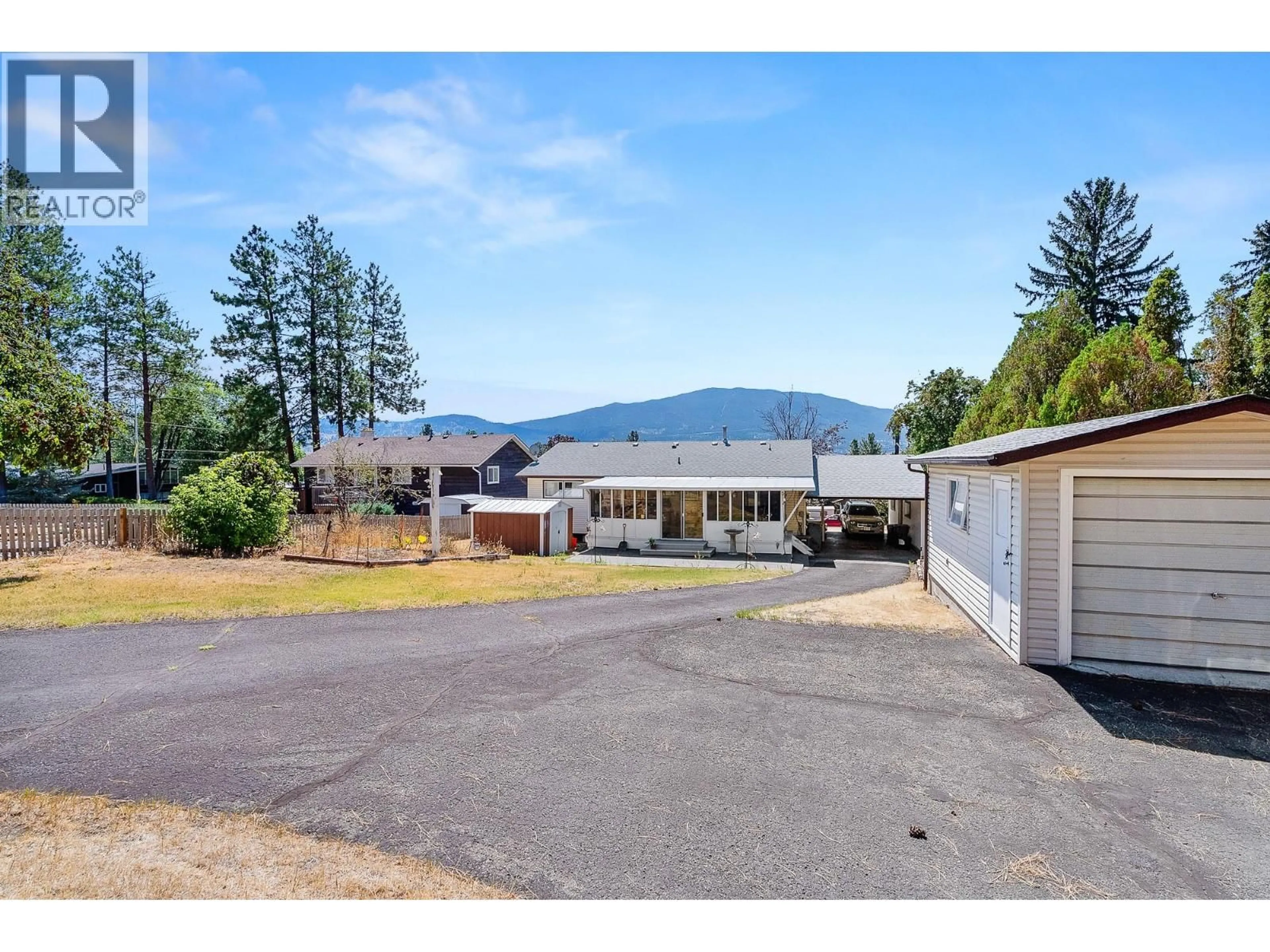 A pic from outside/outdoor area/front of a property/back of a property/a pic from drone, mountain view for 2275 CASTILLOU CRESCENT, Merritt British Columbia V1K1H7