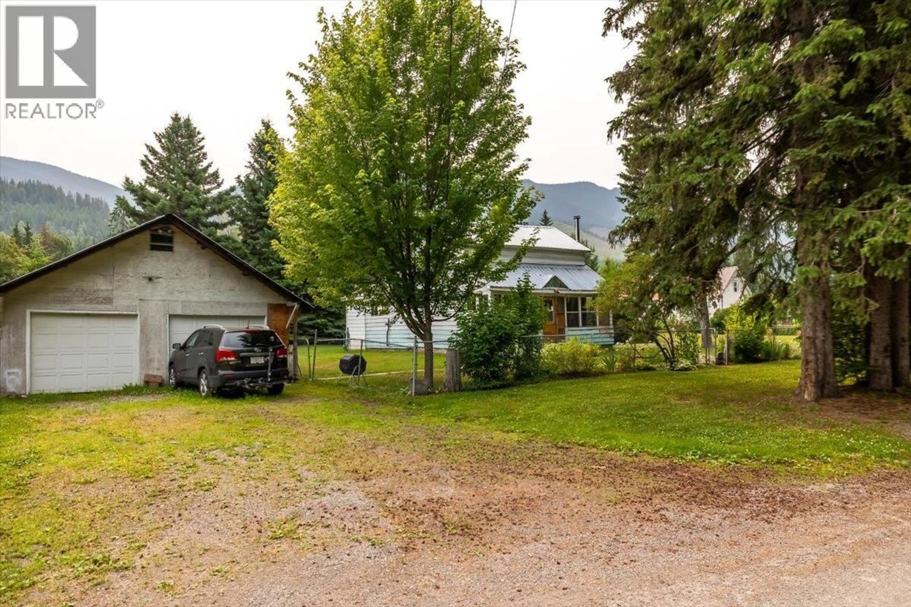 A pic from outside/outdoor area/front of a property/back of a property/a pic from drone, mountain view for 9832 VICTORIA STREET, Fernie British Columbia V0B1M5
