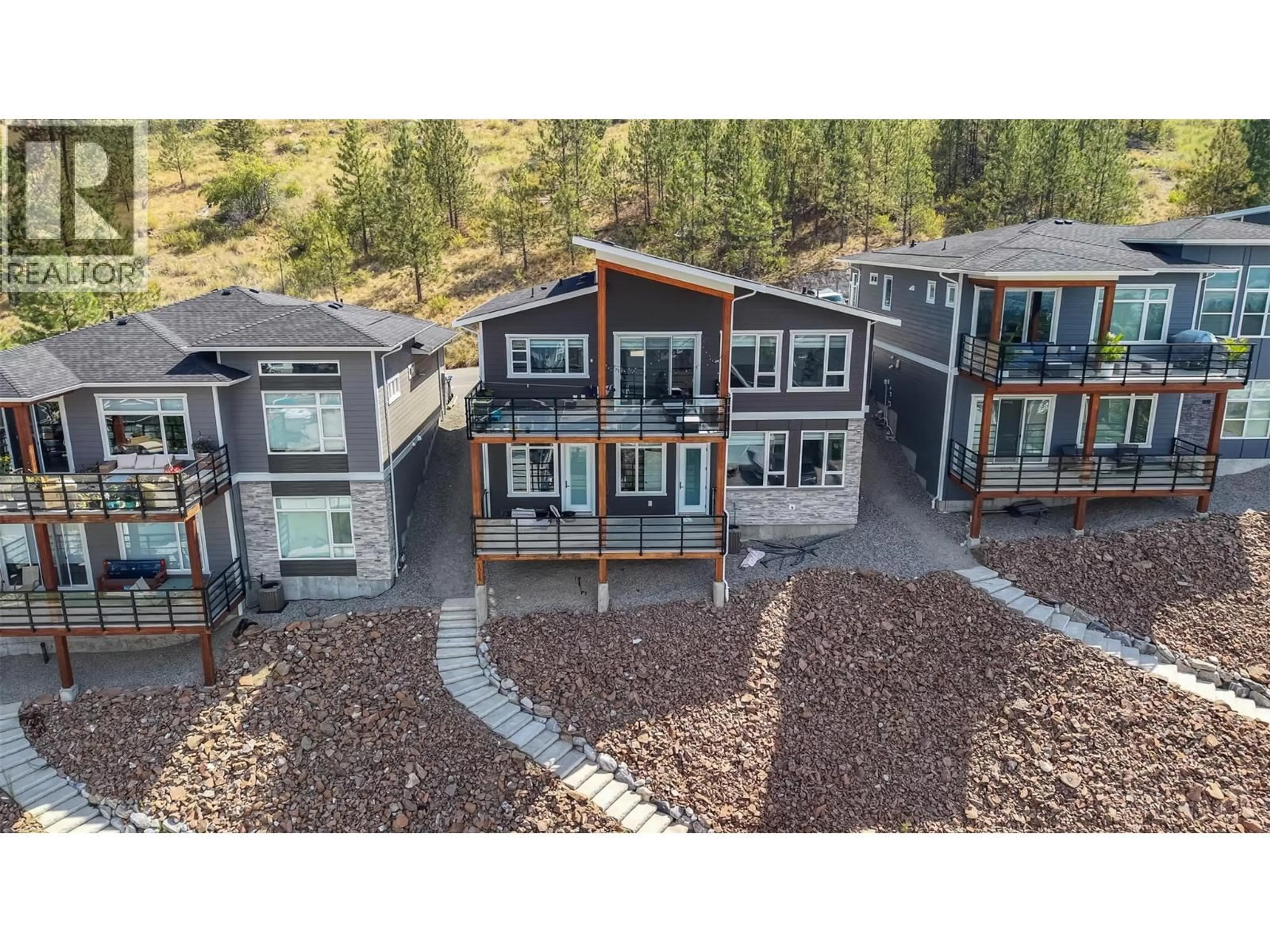 A pic from outside/outdoor area/front of a property/back of a property/a pic from drone, mountain view for 1076 SYER ROAD, Penticton British Columbia V2A9G4
