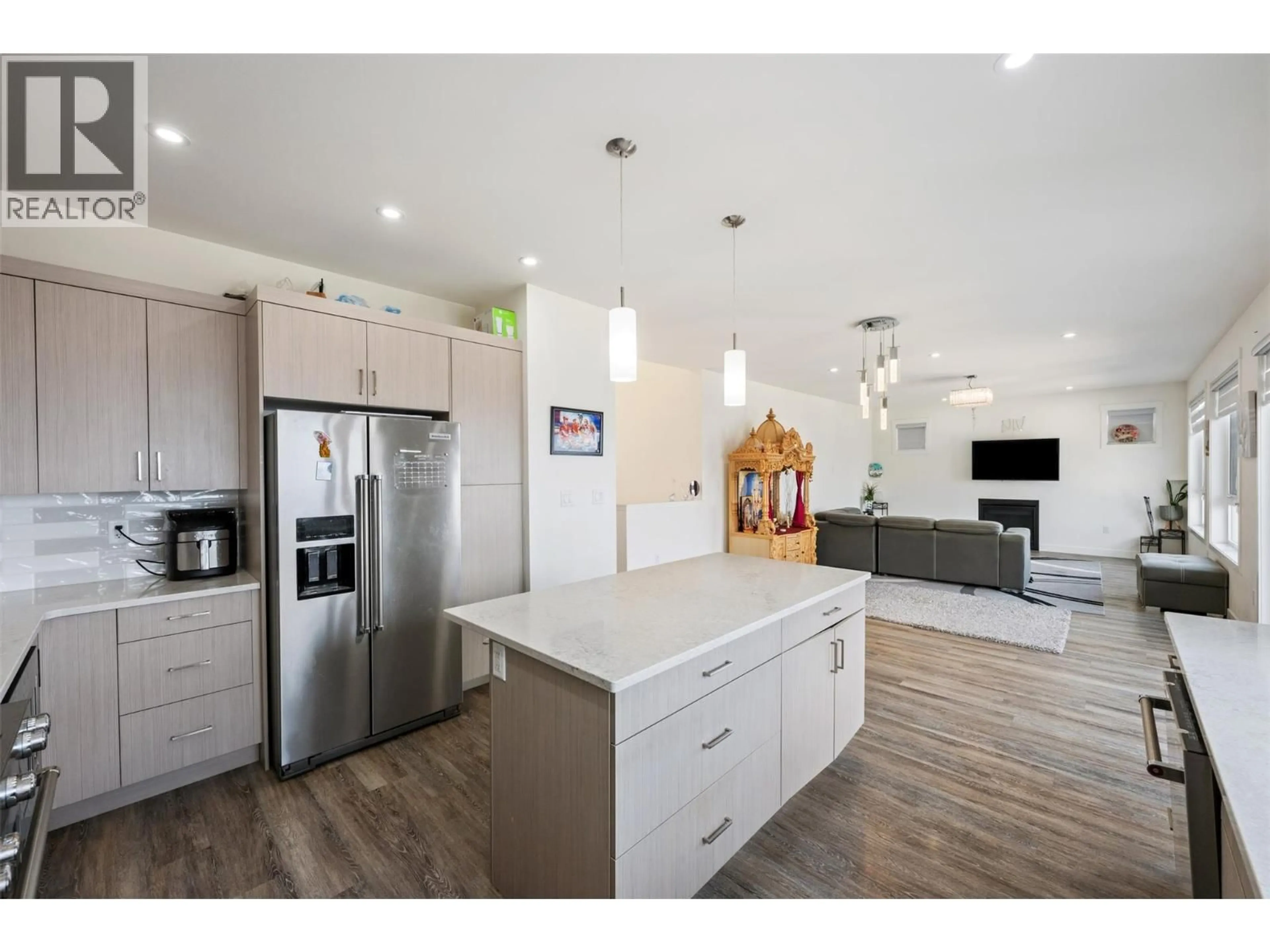Open concept kitchen, wood/laminate floor for 1076 SYER ROAD, Penticton British Columbia V2A9G4